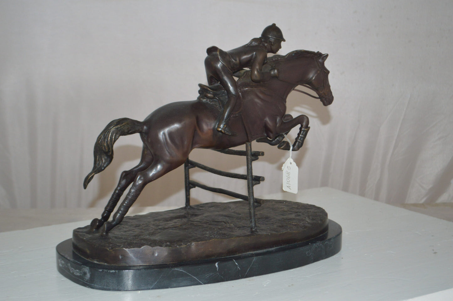 Jockey With Horse Jumping Over Hurdle Bronze Statue - Size: 14"L x 9"W x 13"H.
