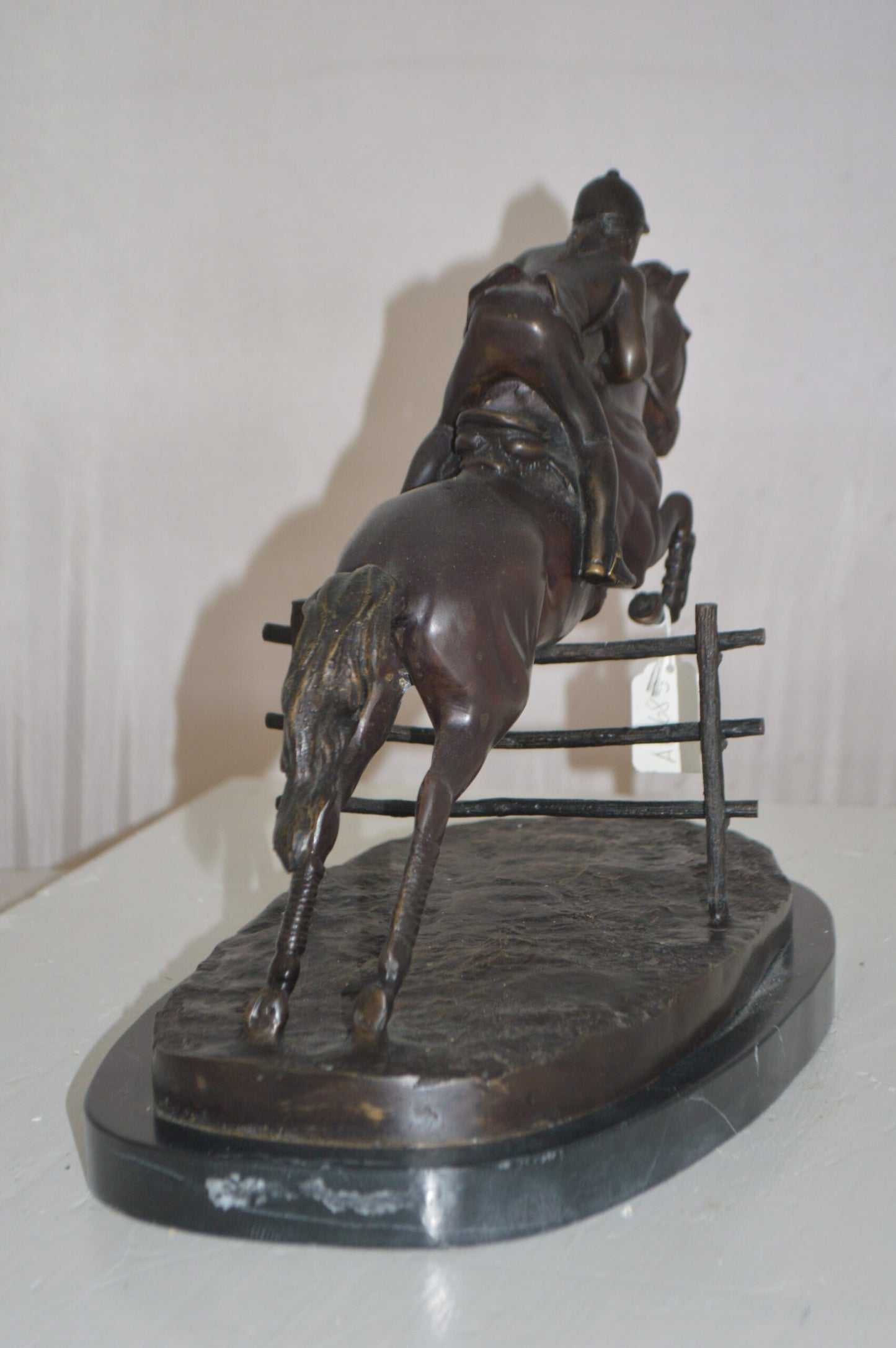 Jockey With Horse Jumping Over Hurdle Bronze Statue - Size: 14"L x 9"W x 13"H.