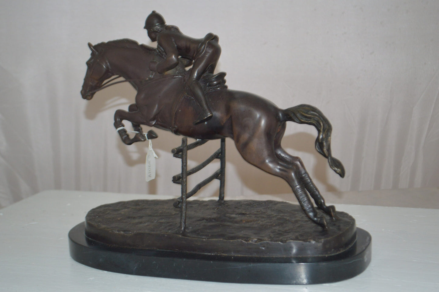 Jockey With Horse Jumping Over Hurdle Bronze Statue - Size: 14"L x 9"W x 13"H.