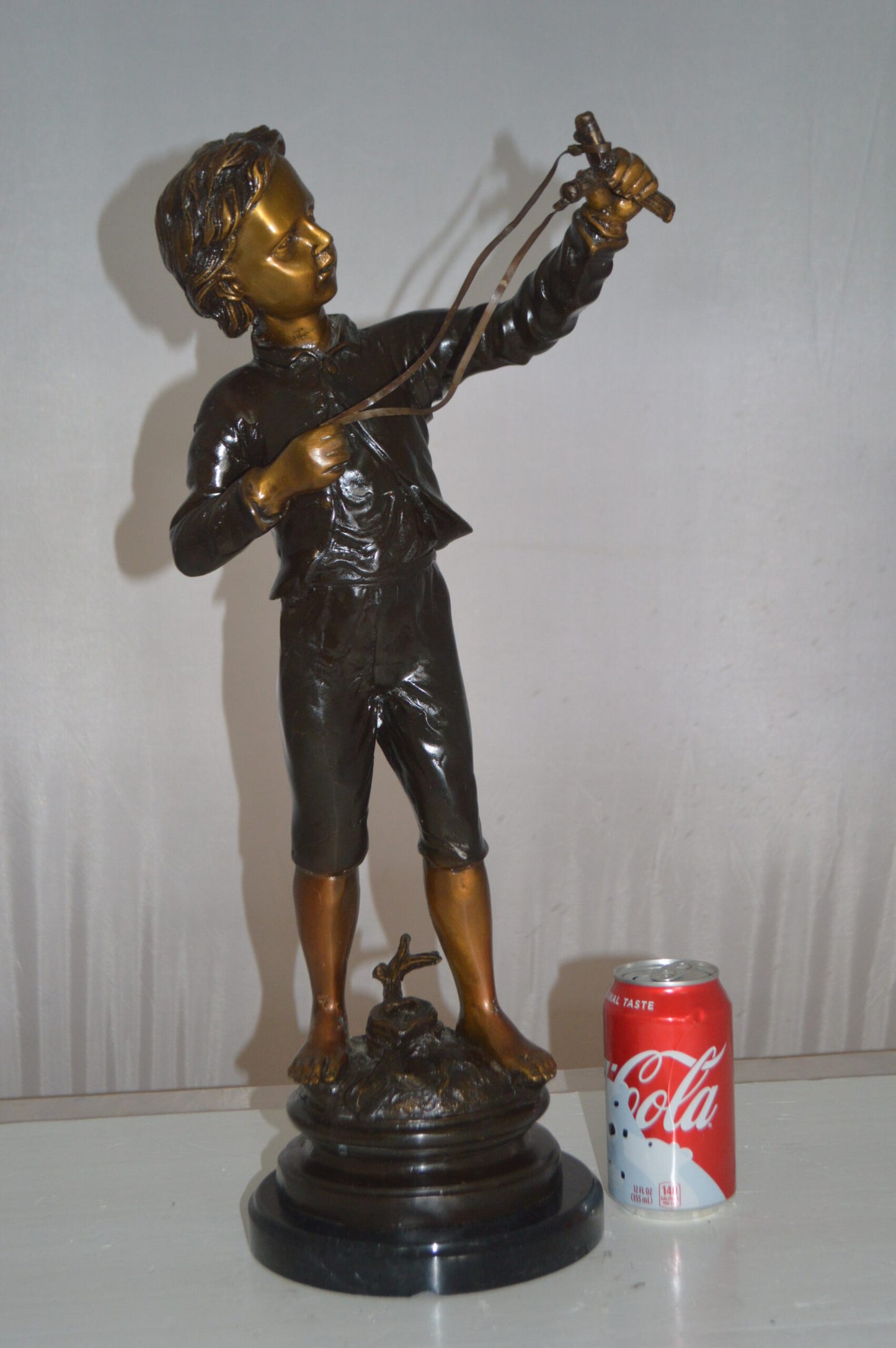 Boy with a Slingshot Bronze Statue -  Size: 12"L x 7"W x 21"H.