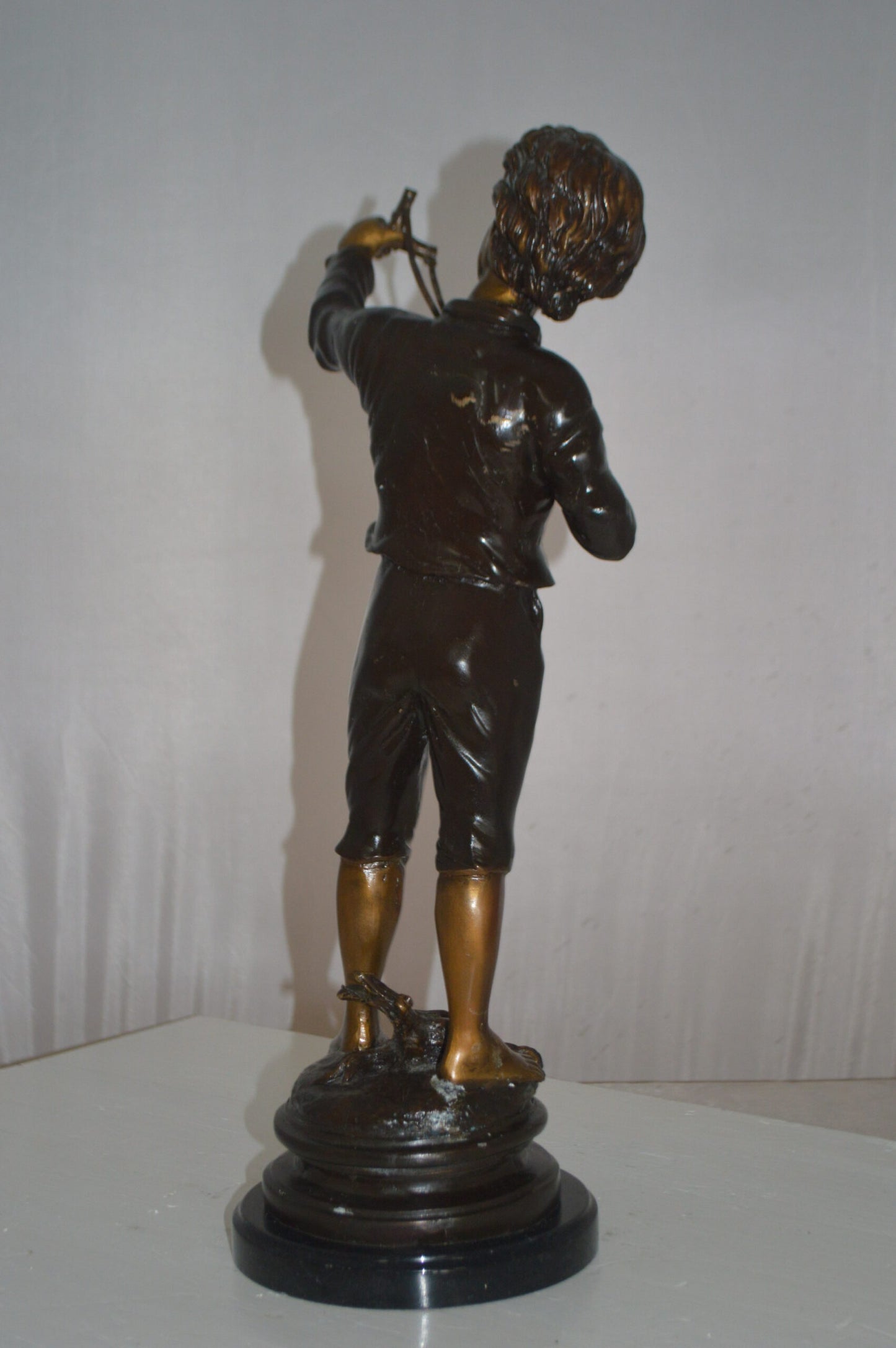 Boy with a Slingshot Bronze Statue -  Size: 12"L x 7"W x 21"H.