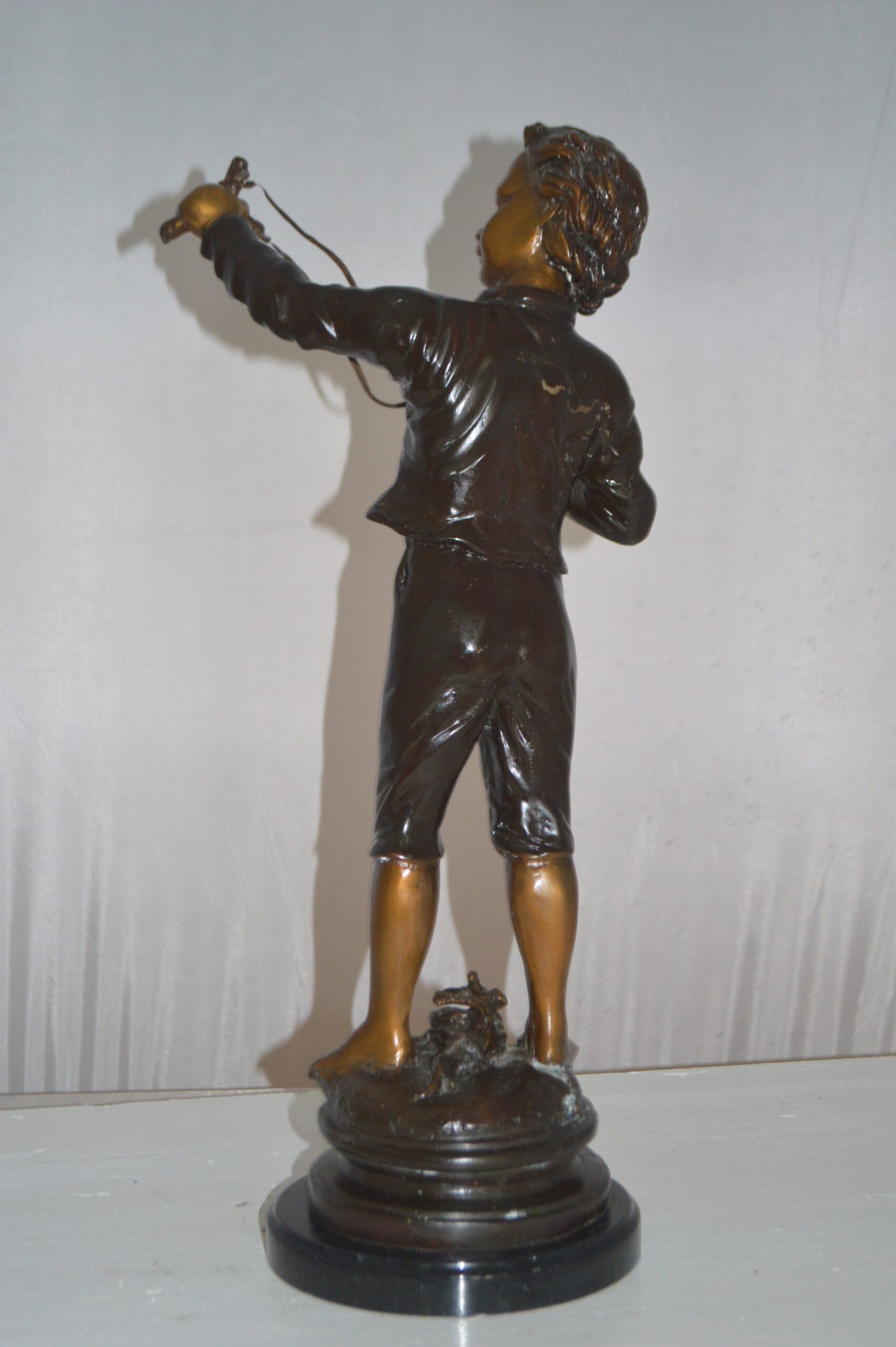Boy with a Slingshot Bronze Statue -  Size: 12"L x 7"W x 21"H.