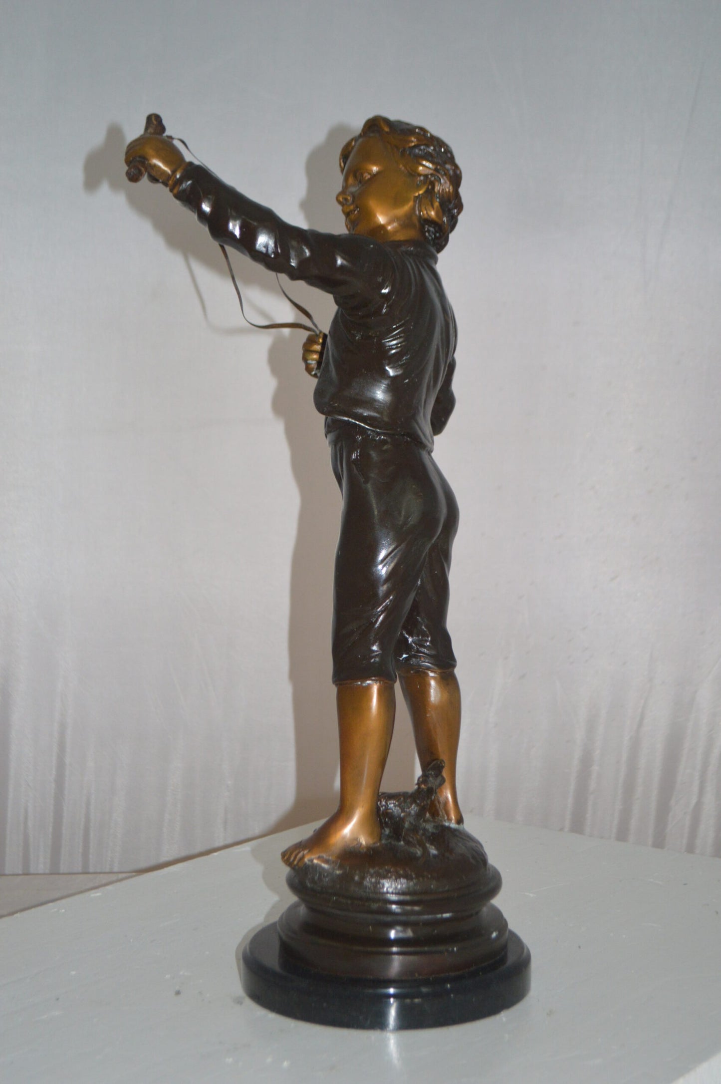 Boy with a Slingshot Bronze Statue -  Size: 12"L x 7"W x 21"H.
