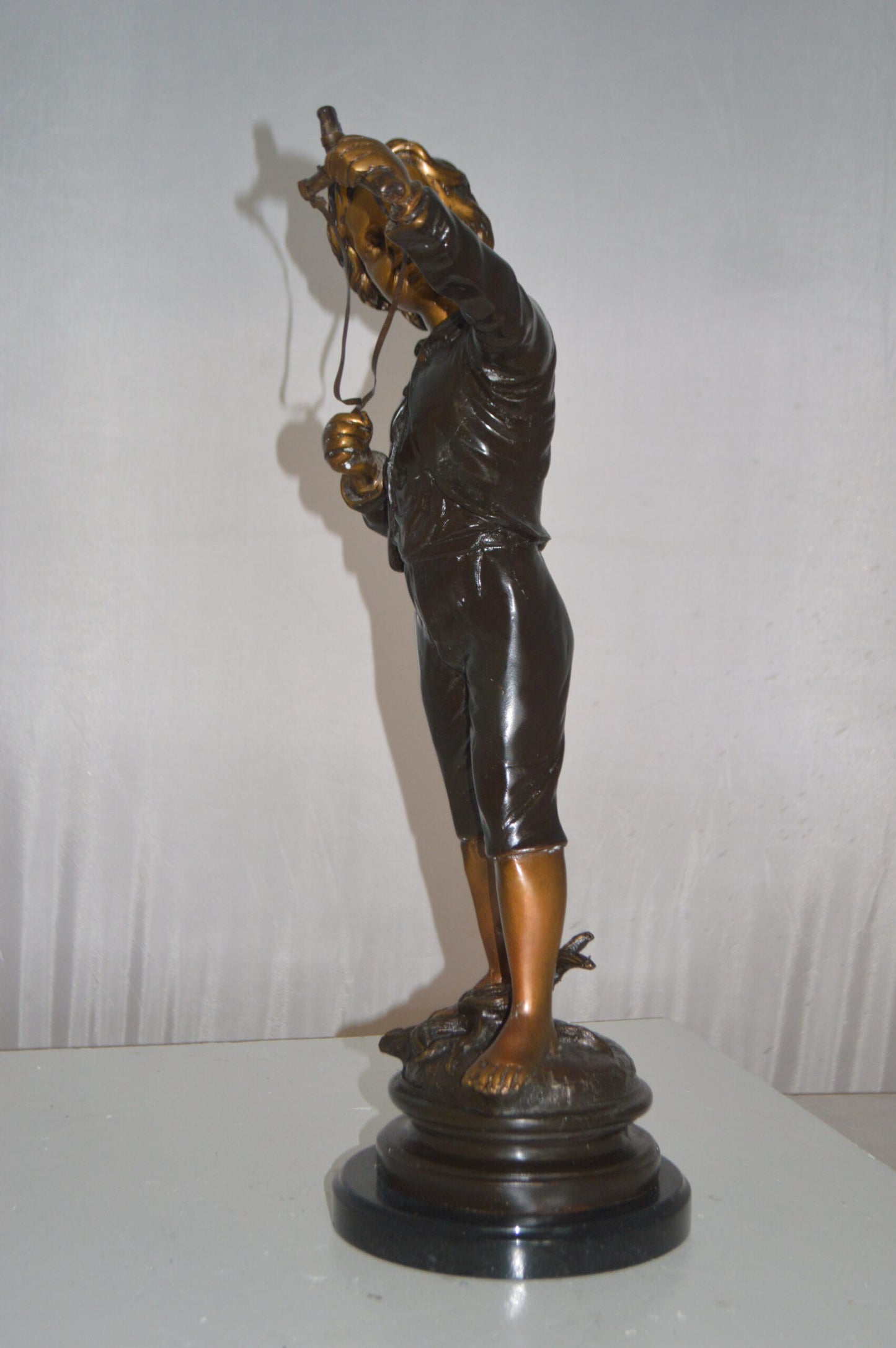 Boy with a Slingshot Bronze Statue -  Size: 12"L x 7"W x 21"H.