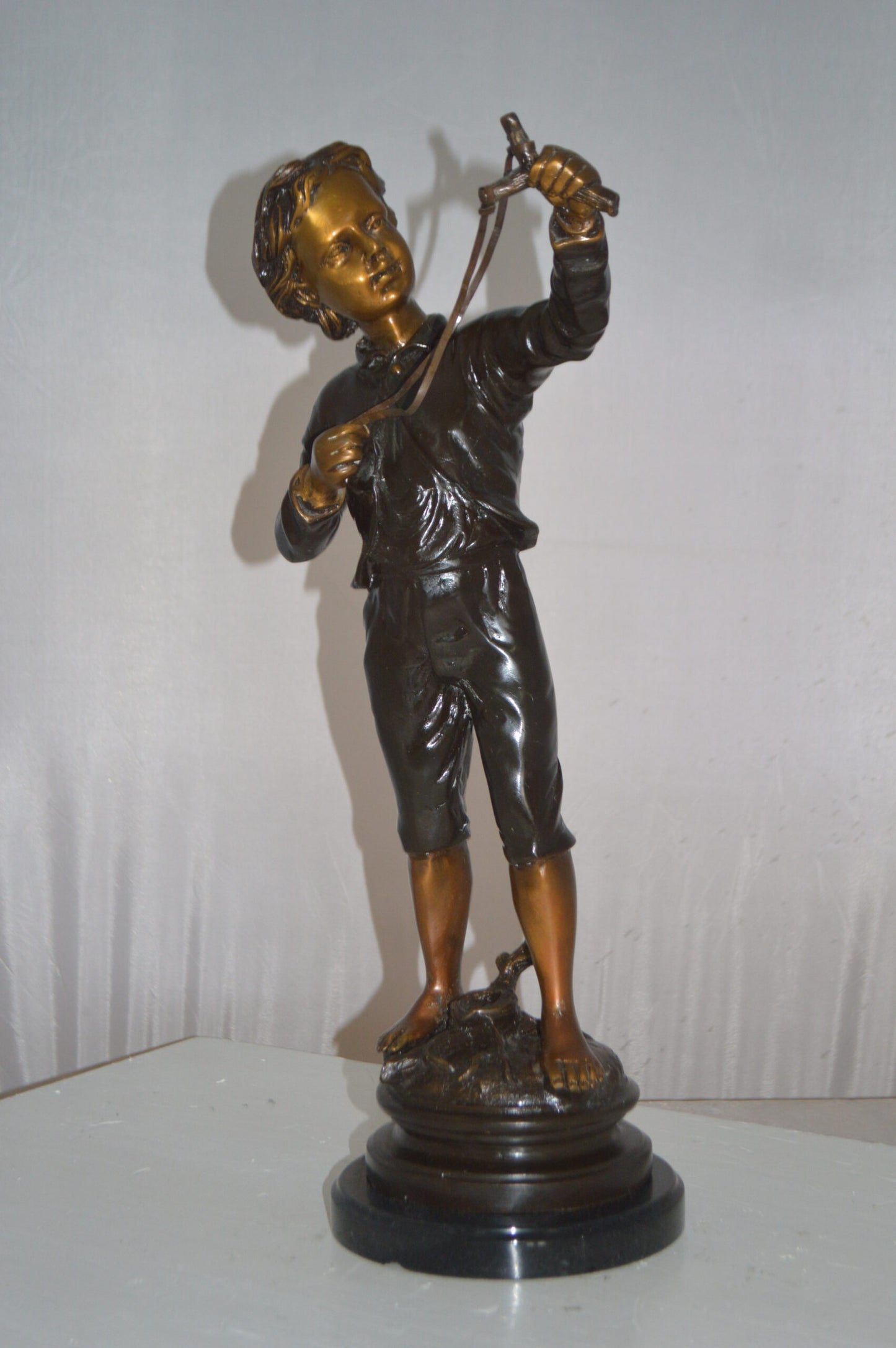 Boy with a Slingshot Bronze Statue -  Size: 12"L x 7"W x 21"H.
