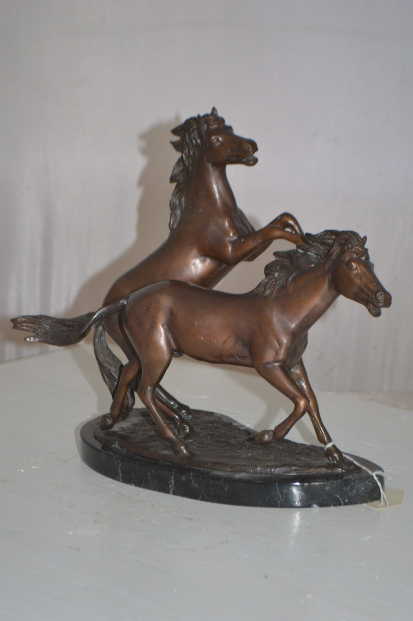 Two Horses Running Bronze Statue -  Size: 11"L x 5"W x 11"H.
