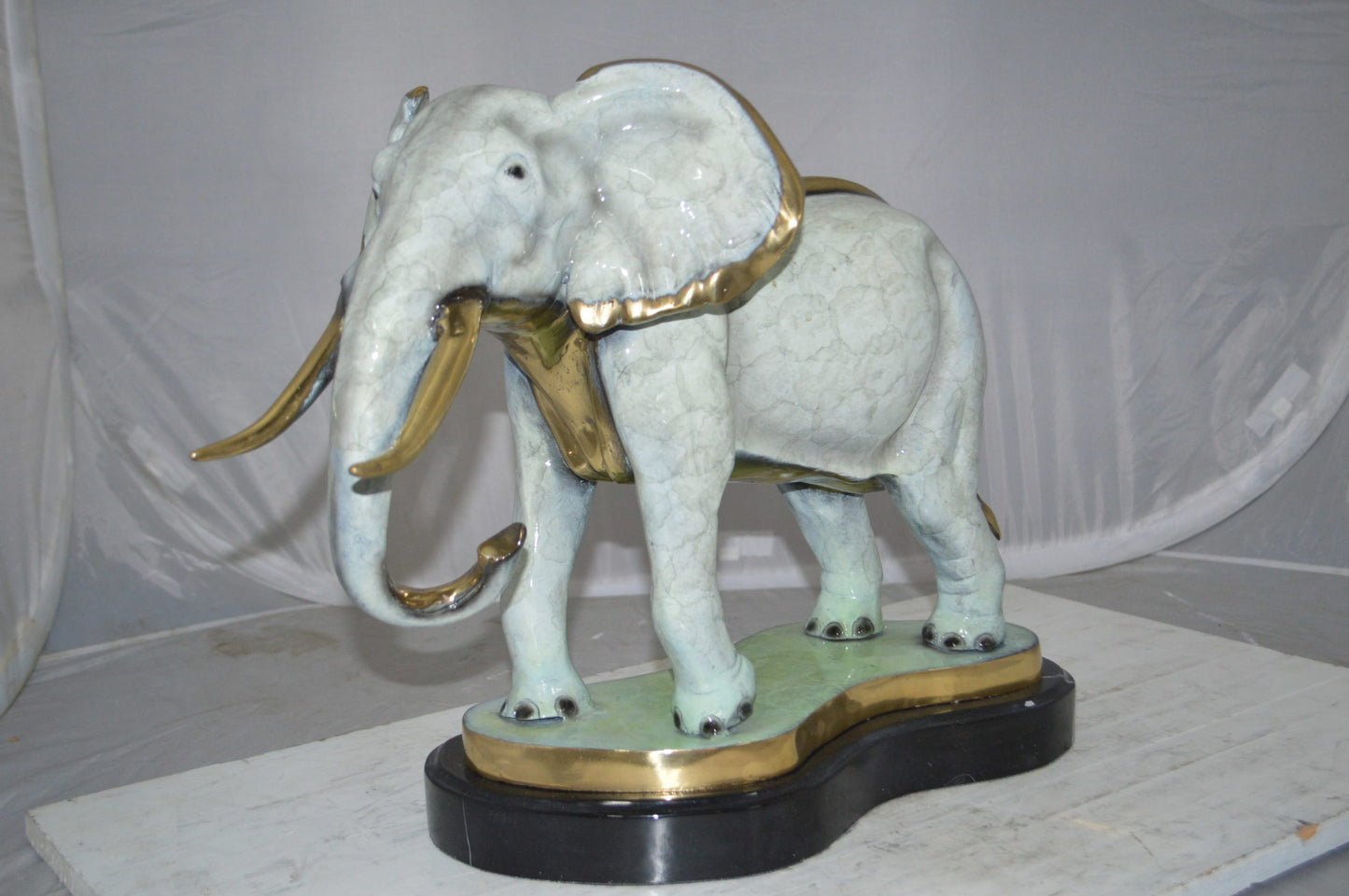 Elephant trunk Down Bronze Statue -  Size: 28"L x 12"W x 17"H.