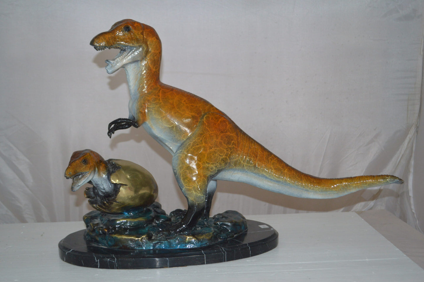Dinosaur and baby Dino Bronze Statue -  Size: 26"L x 11"W x 18"H.