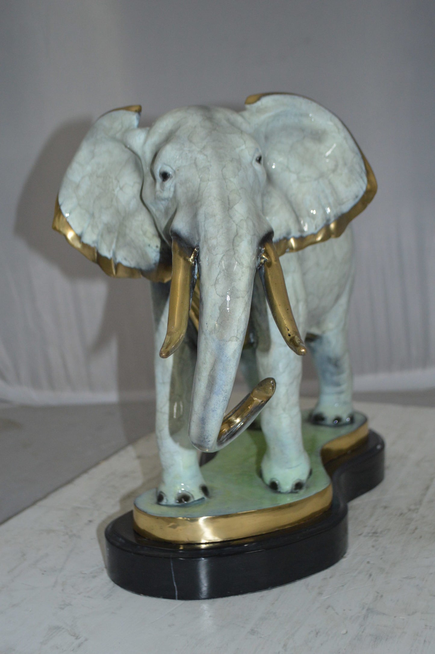 Elephant trunk Down Bronze Statue -  Size: 28"L x 12"W x 17"H.
