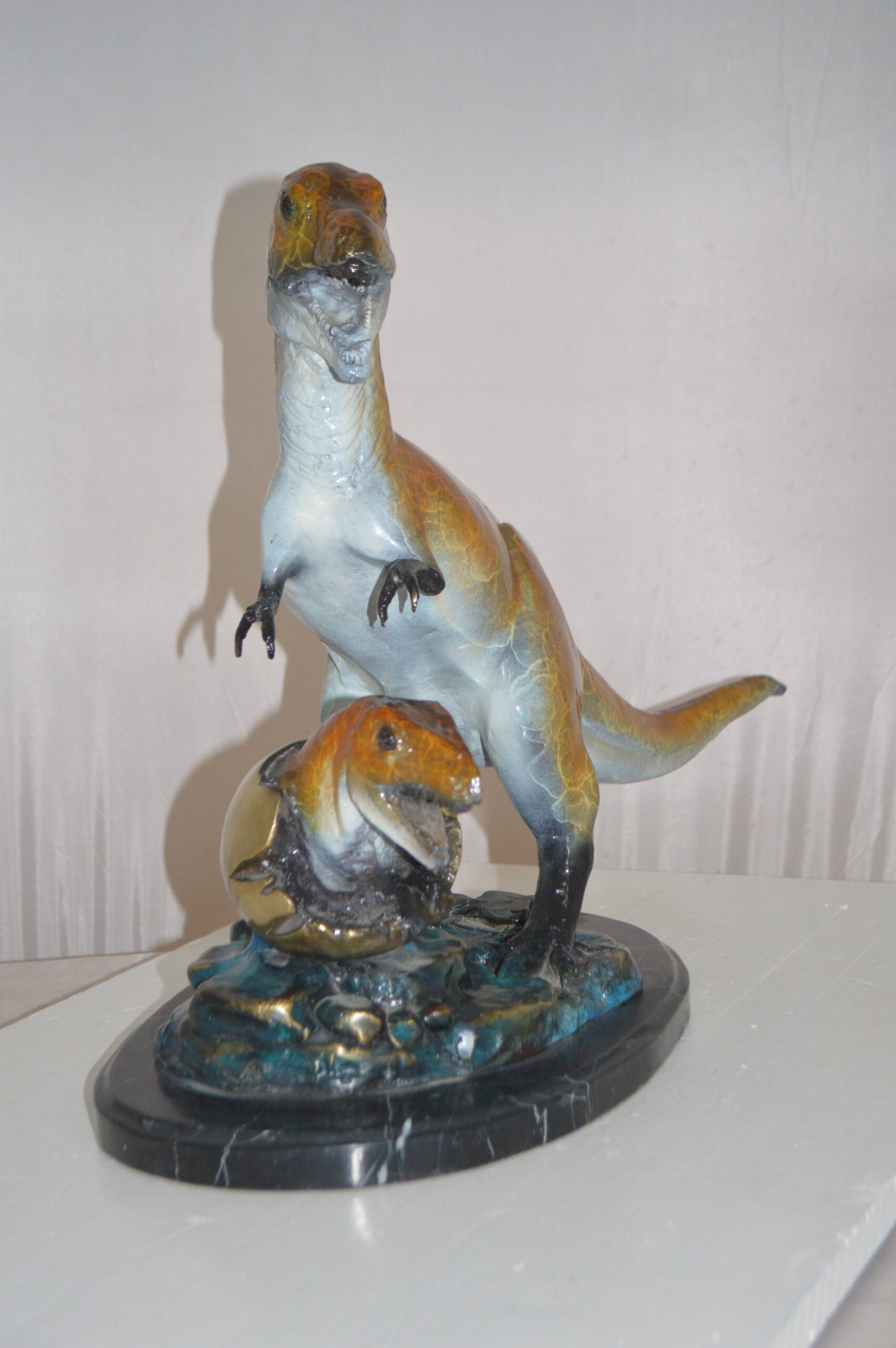 Dinosaur and baby Dino Bronze Statue -  Size: 26"L x 11"W x 18"H.