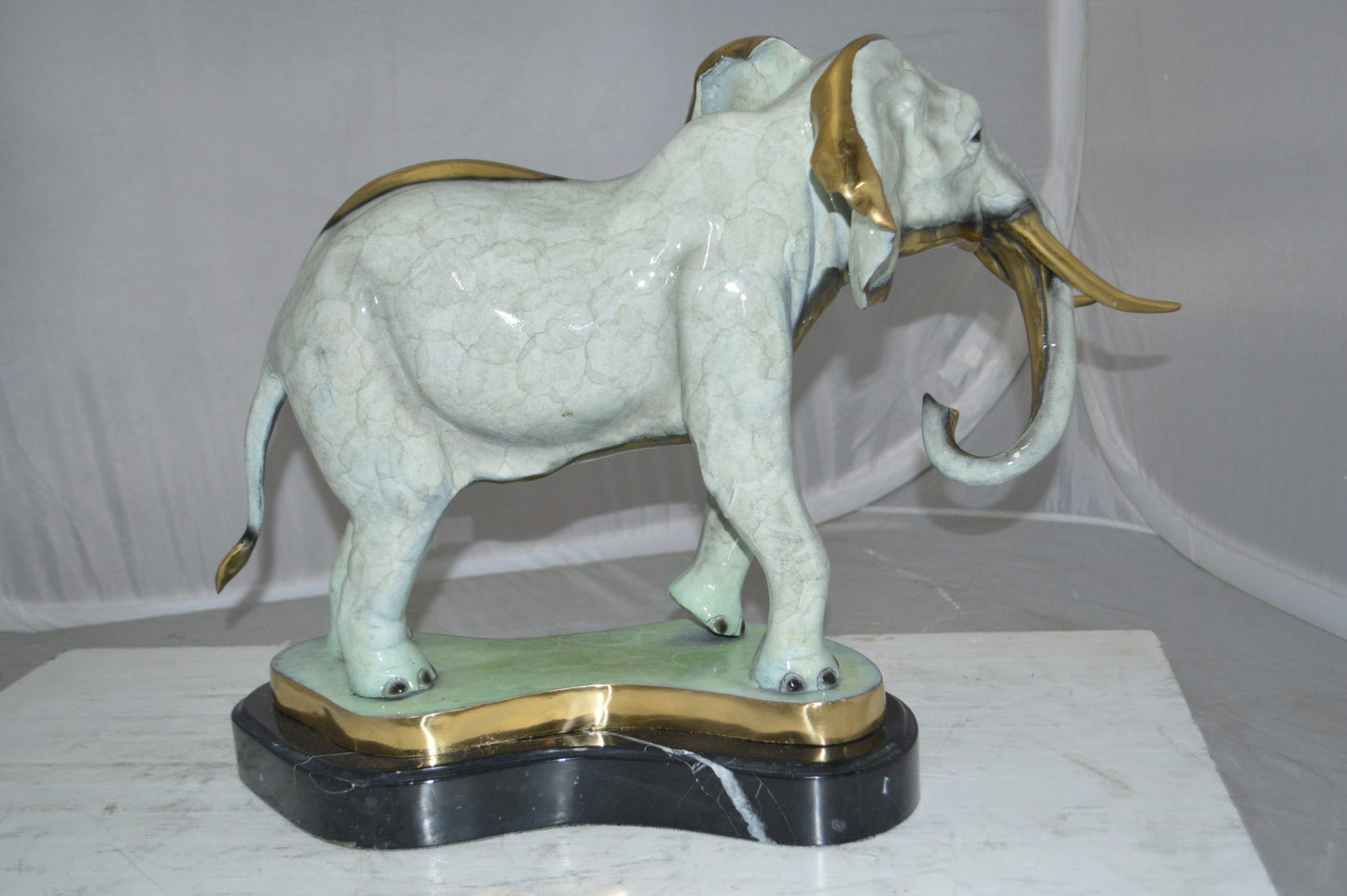 Elephant trunk Down Bronze Statue -  Size: 28"L x 12"W x 17"H.
