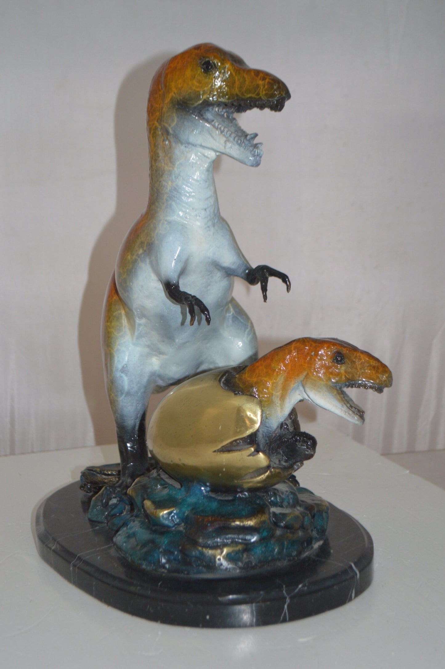 Dinosaur and baby Dino Bronze Statue -  Size: 26"L x 11"W x 18"H.
