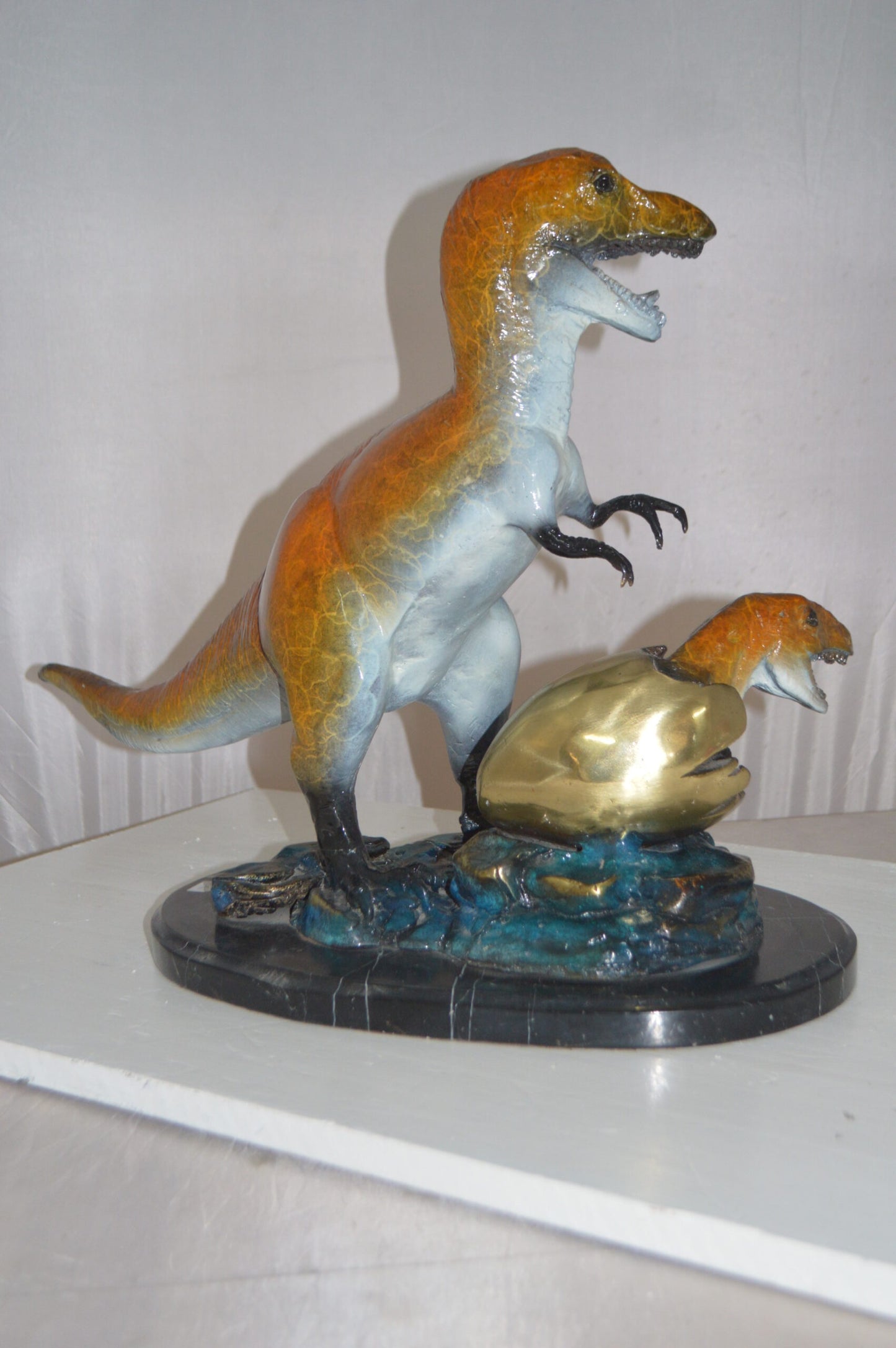 Dinosaur and baby Dino Bronze Statue -  Size: 26"L x 11"W x 18"H.