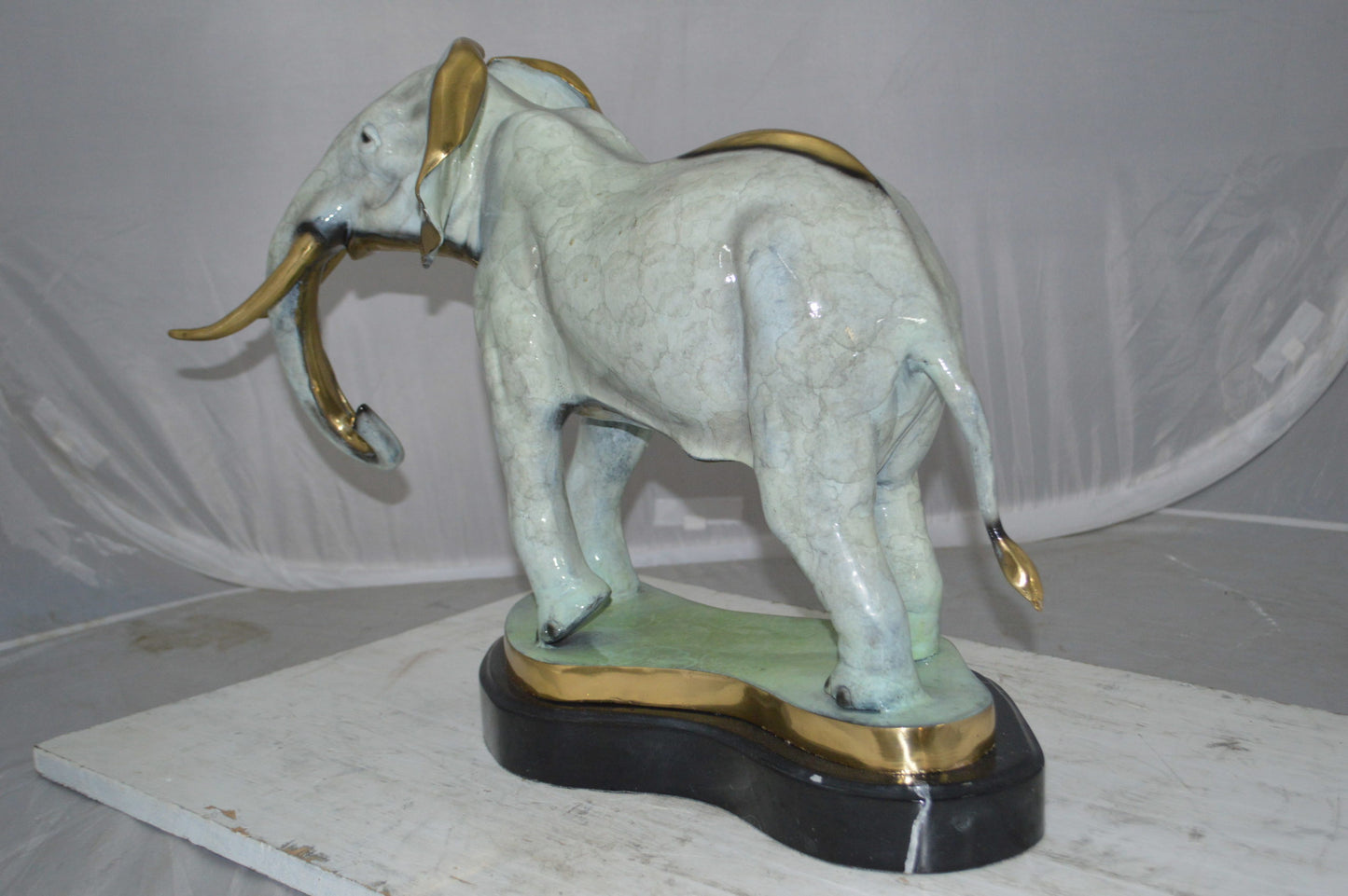 Elephant trunk Down Bronze Statue -  Size: 28"L x 12"W x 17"H.