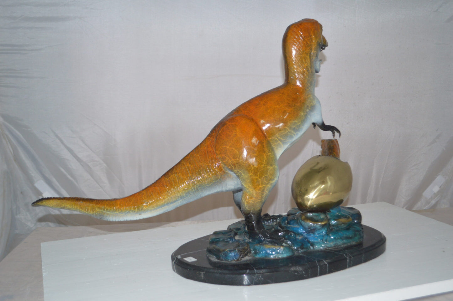 Dinosaur and baby Dino Bronze Statue - Size: 26"L x 11"W x 18"H.