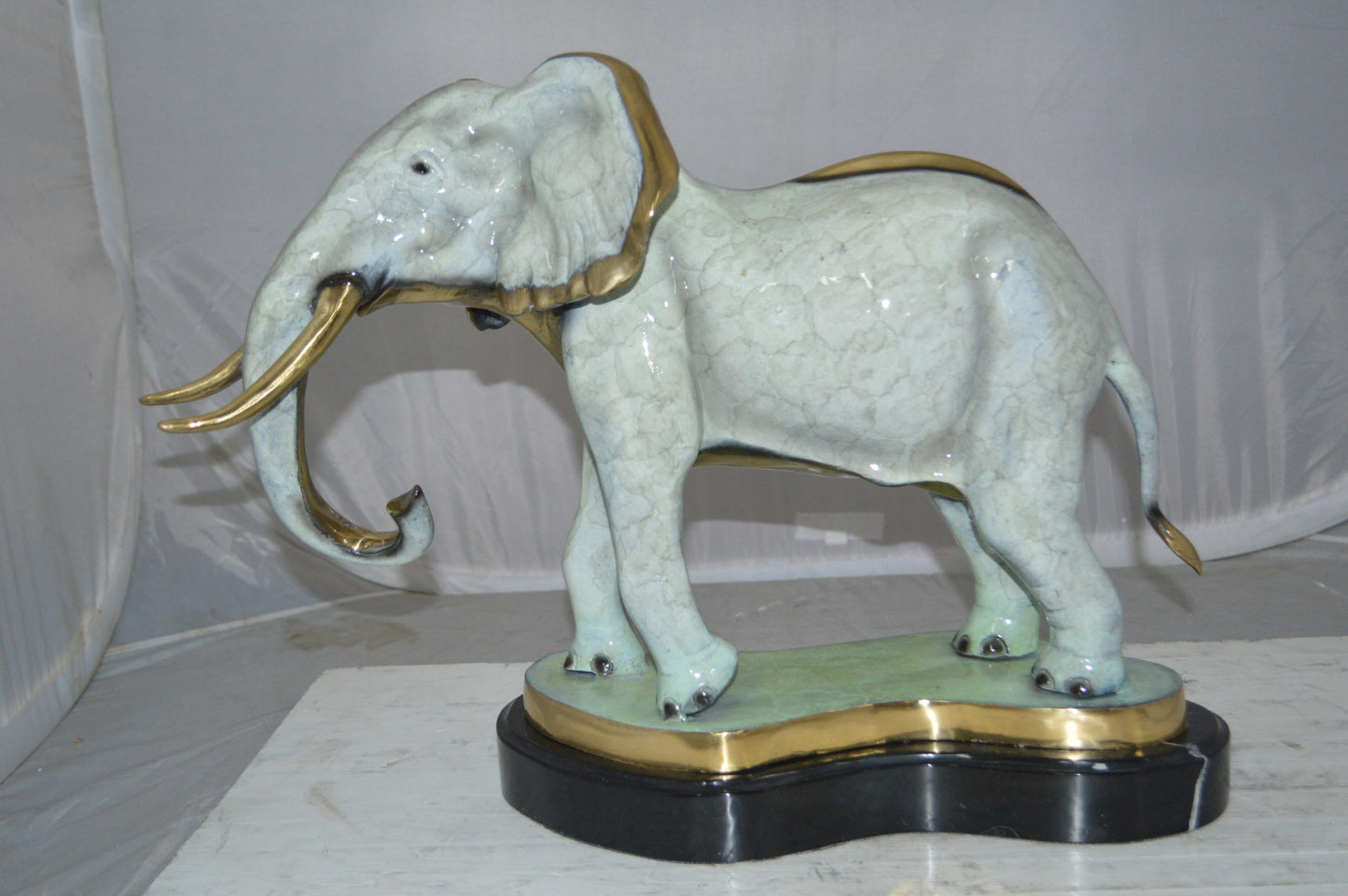 Elephant trunk Down Bronze Statue - Size: 28"L x 12"W x 17"H.