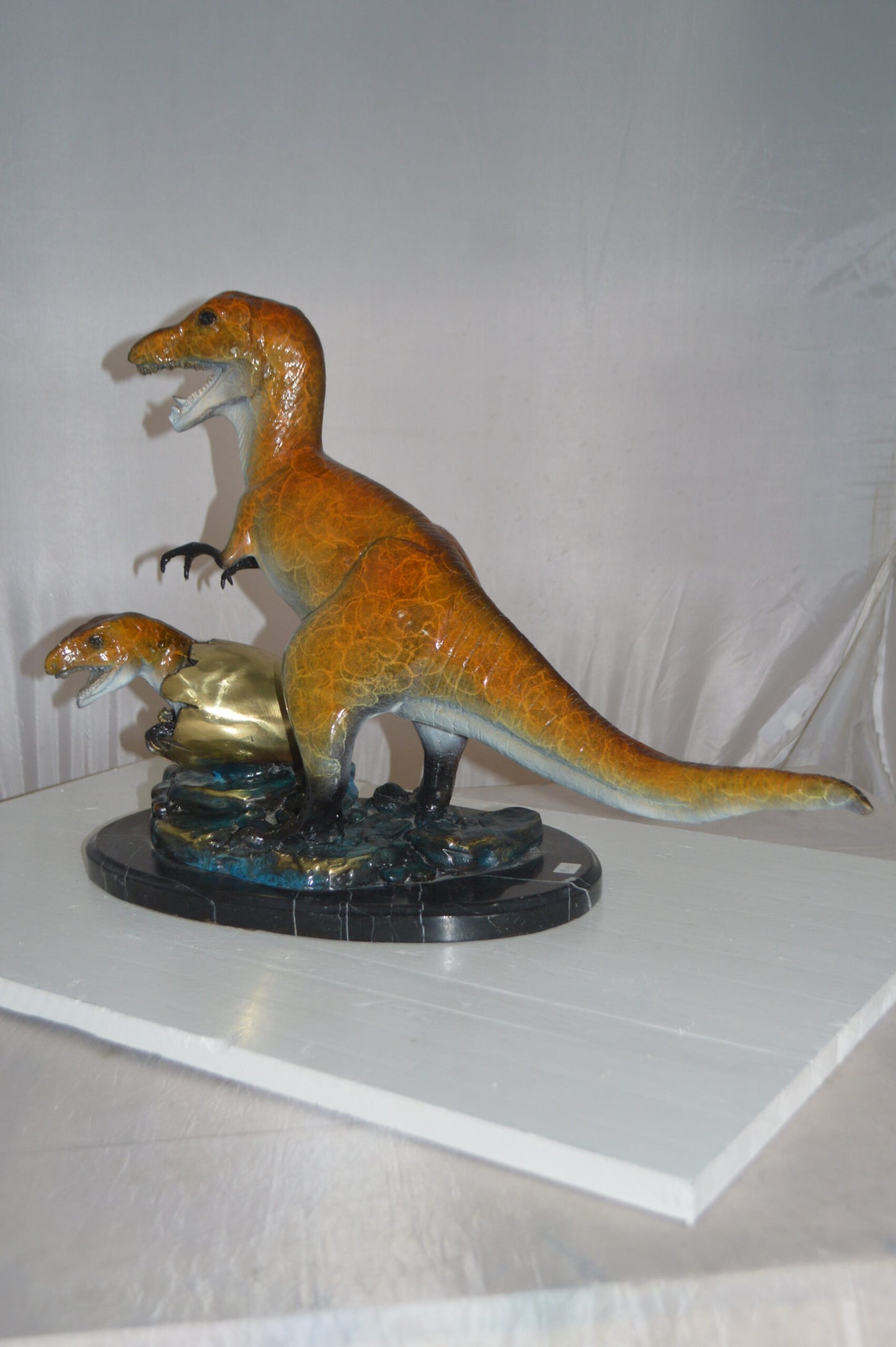 Dinosaur and baby Dino Bronze Statue -  Size: 26"L x 11"W x 18"H.