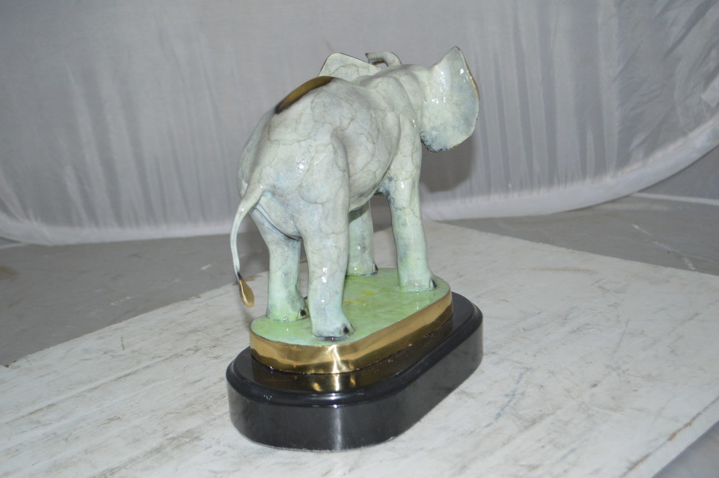 Elephant trunk Up Bronze Statue - Size: 16"L x 9"W x 10"H.