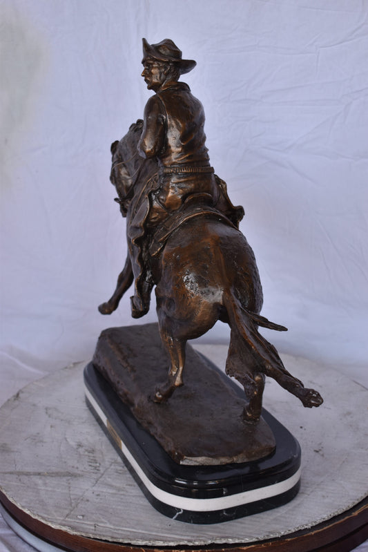 Remington Cowboy Replica Bronze Statue on Triple Marble - Size: 8"x 26"x 23"H.
