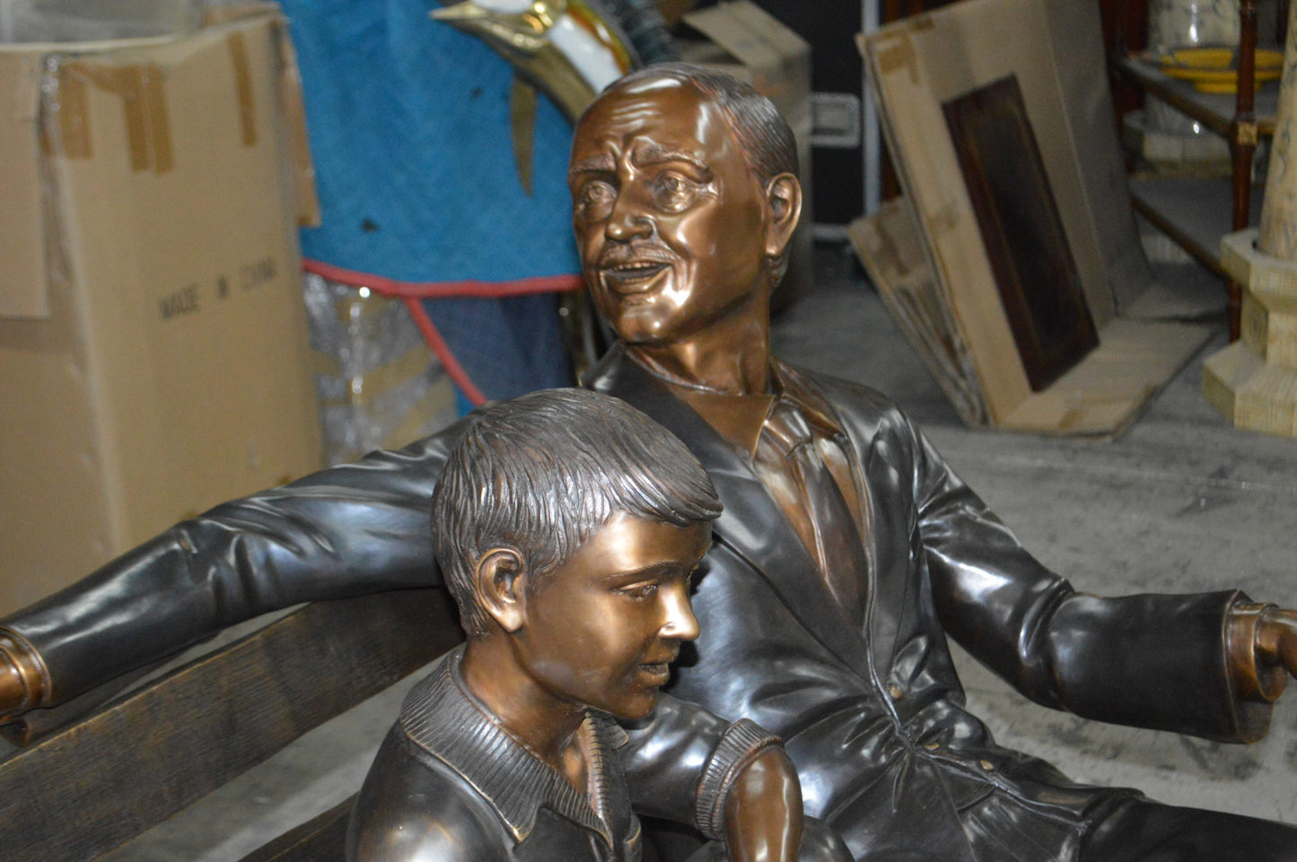 Grandfather an Grandson on a Bench Bronze Statue - Size: 53"L x 32"W x 44"H.
