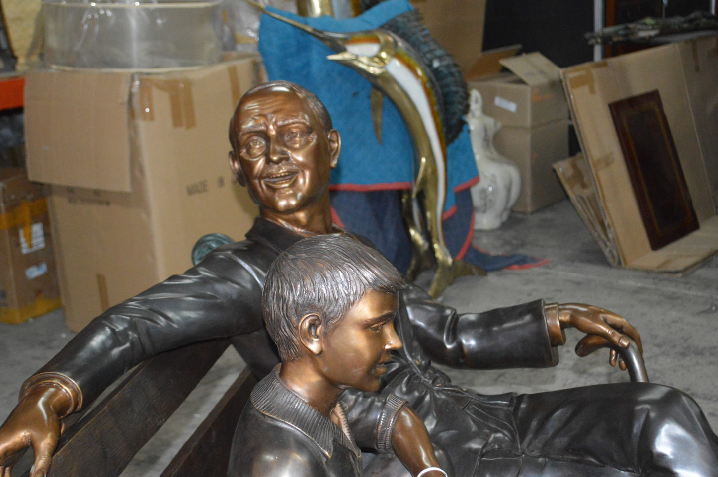 Grandfather an Grandson on a Bench Bronze Statue - Size: 53"L x 32"W x 44"H.
