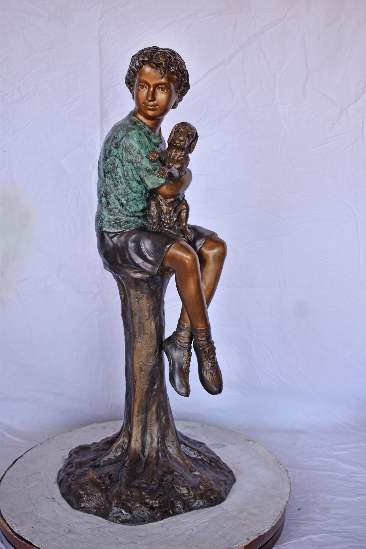 Boy Sitting on A Log with His Puppy Bronze Statue - Size: 15"L x 15"W x 35"H.