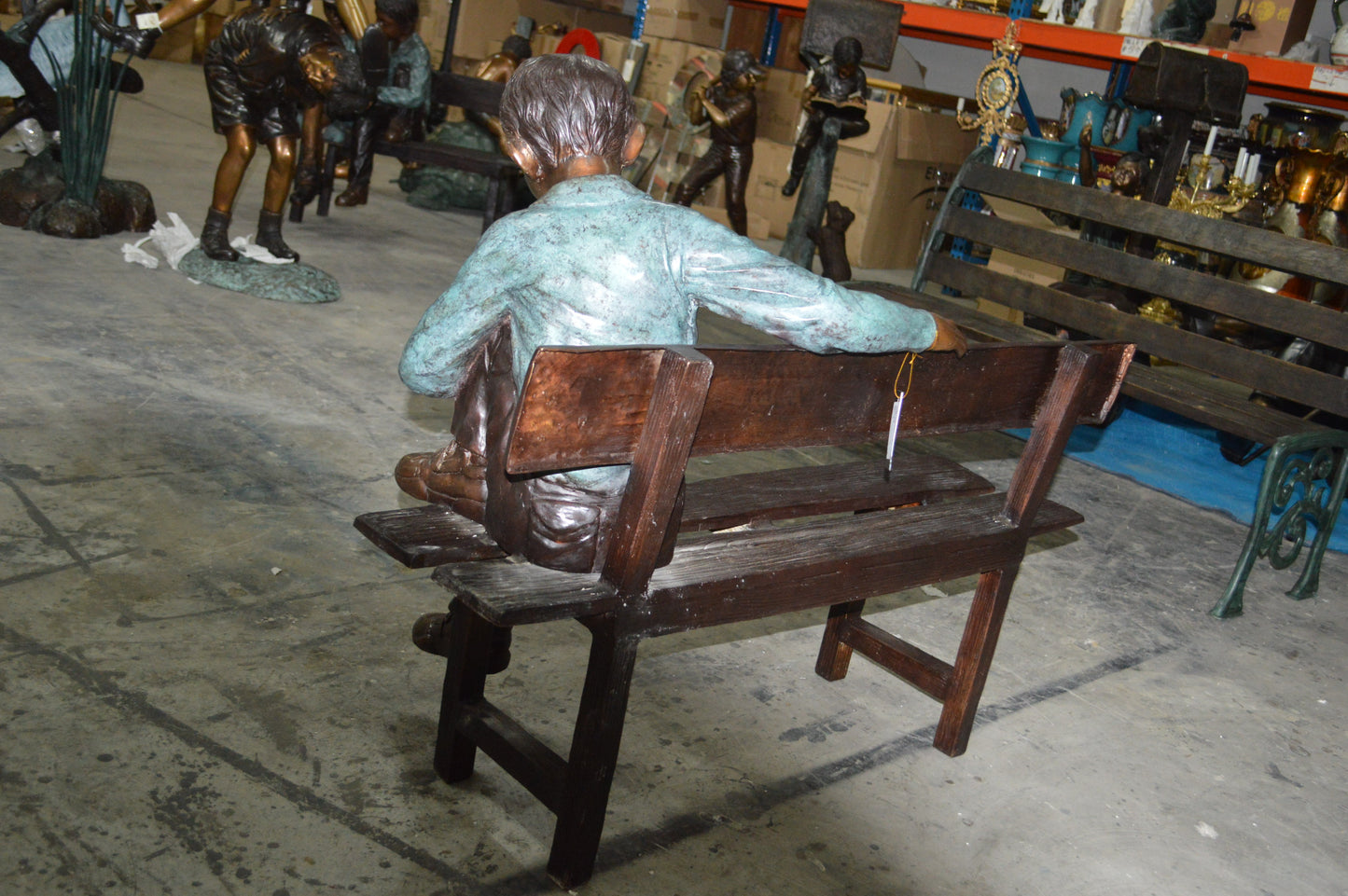 boy Sitting on a Bench reading book bronze Statue - Size: 43"L x 20"W x 36"H.