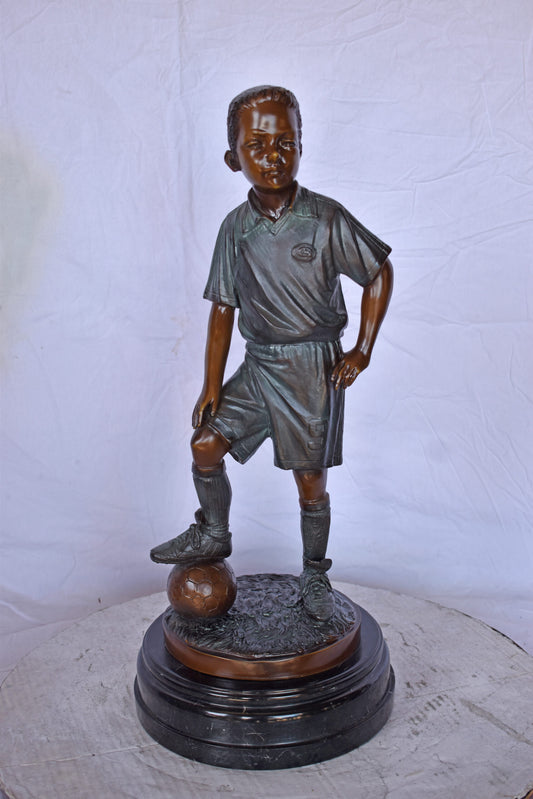 Soccer Boy Player in Action Bronze Statue on Marble - Size: 12"L x 12"W x 26"H.