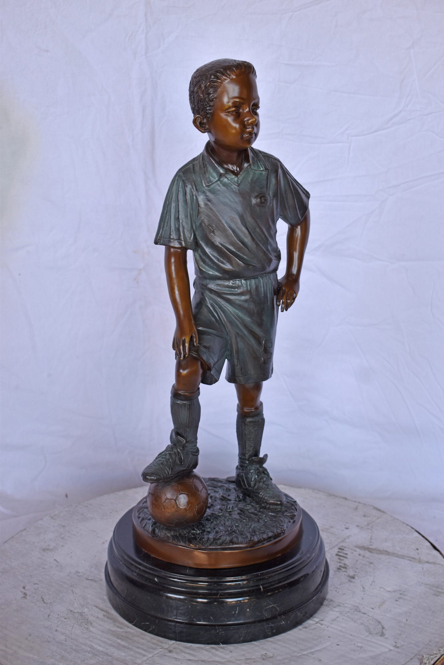 Soccer Boy Player in Action Bronze Statue on Marble - Size: 12"L x 12"W x 26"H.