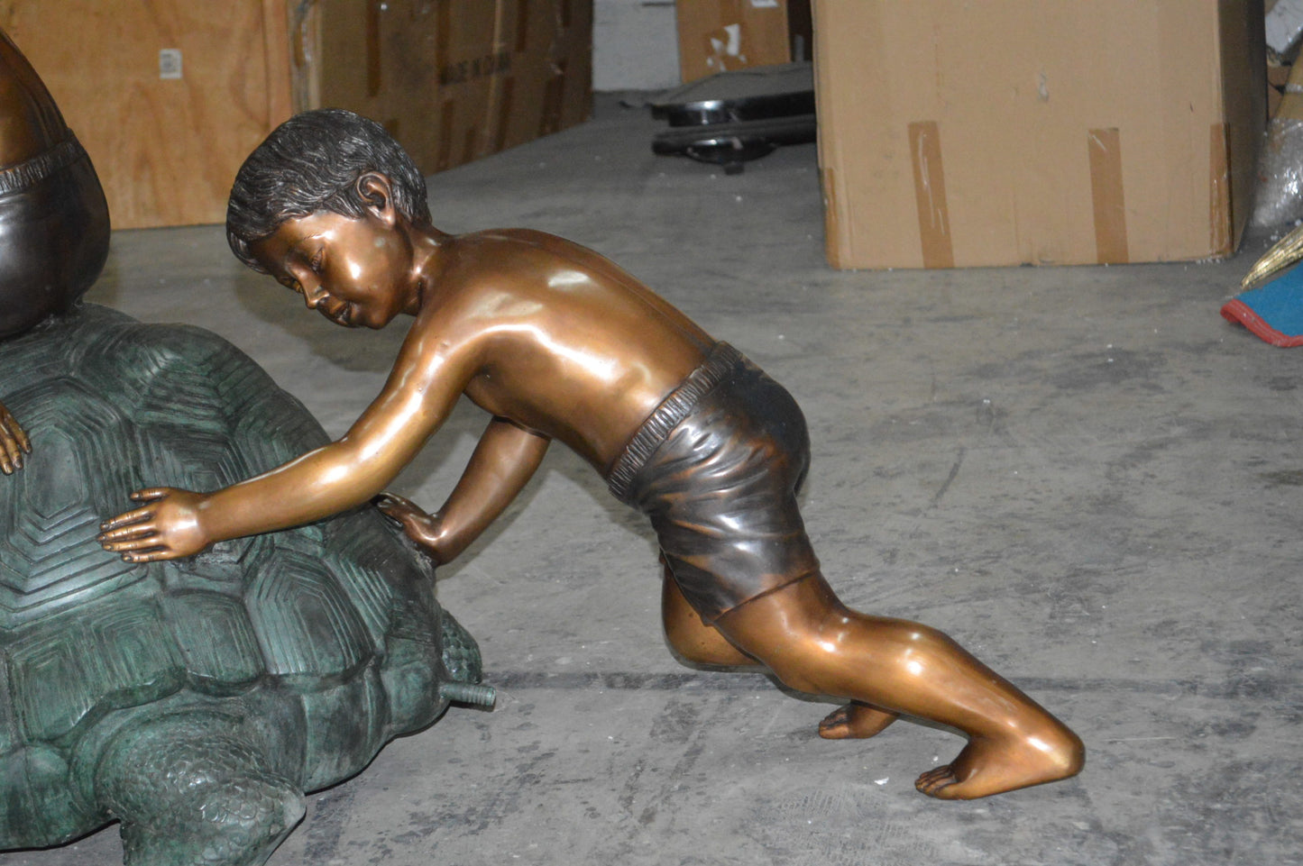 Two Kids on a Giant Turtle Bronze Fountain - Size: 23"L x 60"W x 33"H.