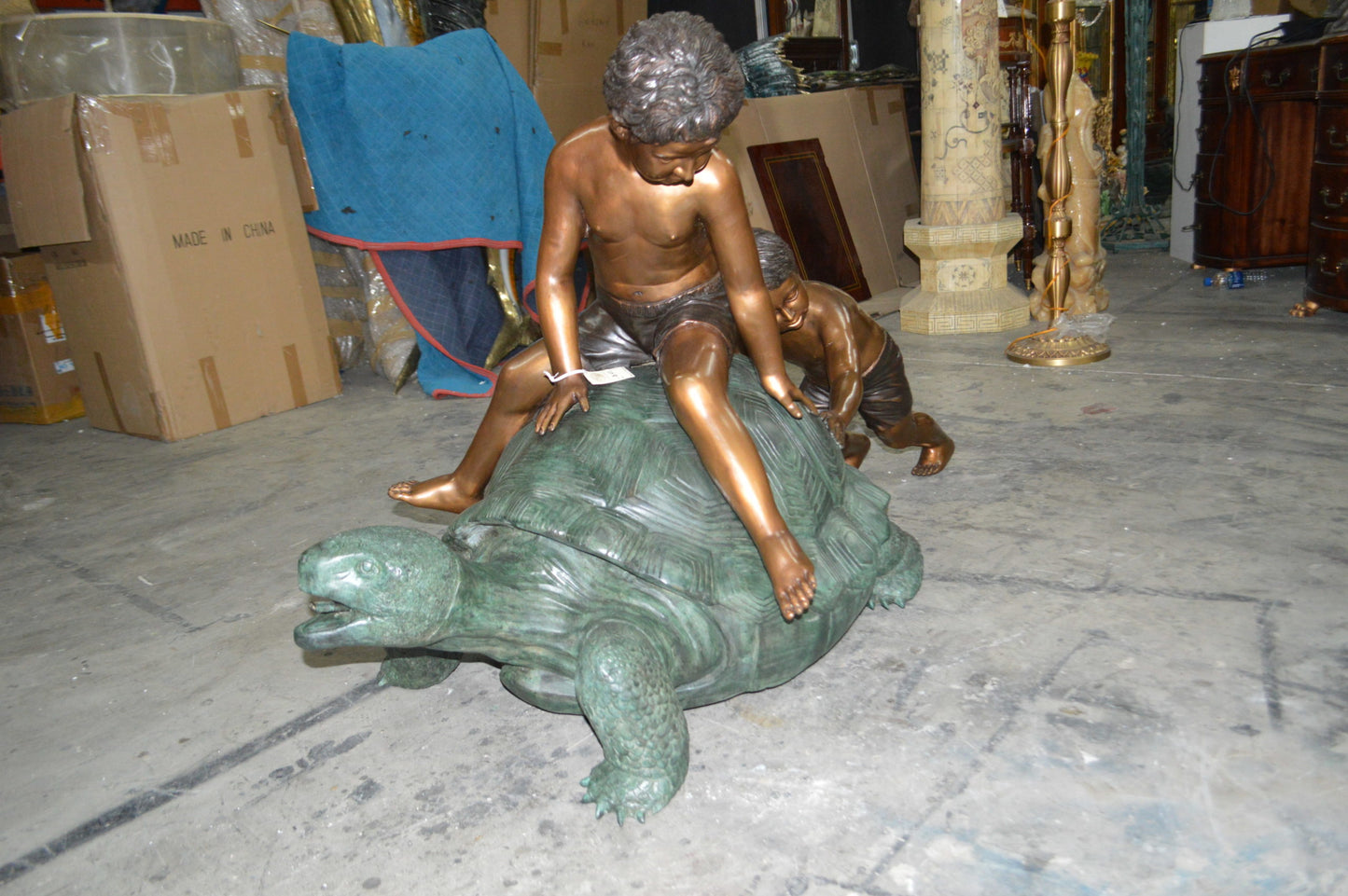 Two Kids on a Giant Turtle Bronze Fountain - Size: 23"L x 60"W x 33"H.