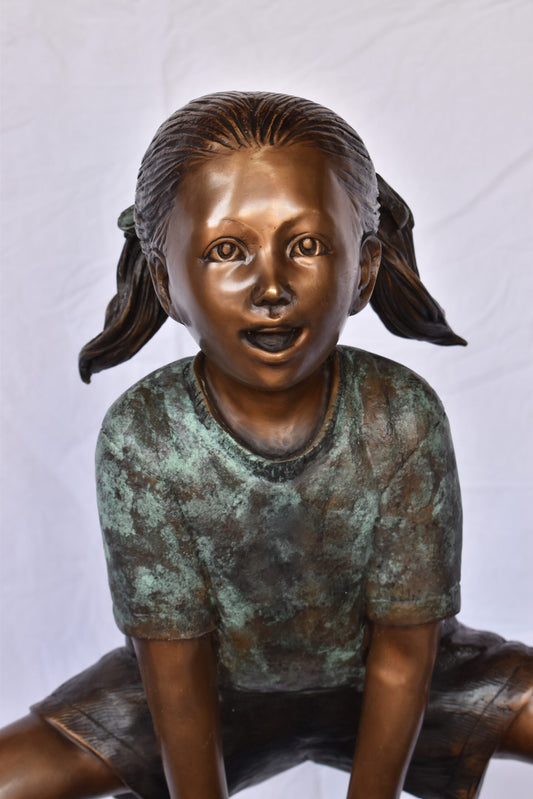 Two Girls Playing Leapfrog Jumping Bronze Statue - Size: 30"L x 14"W x 34"H.