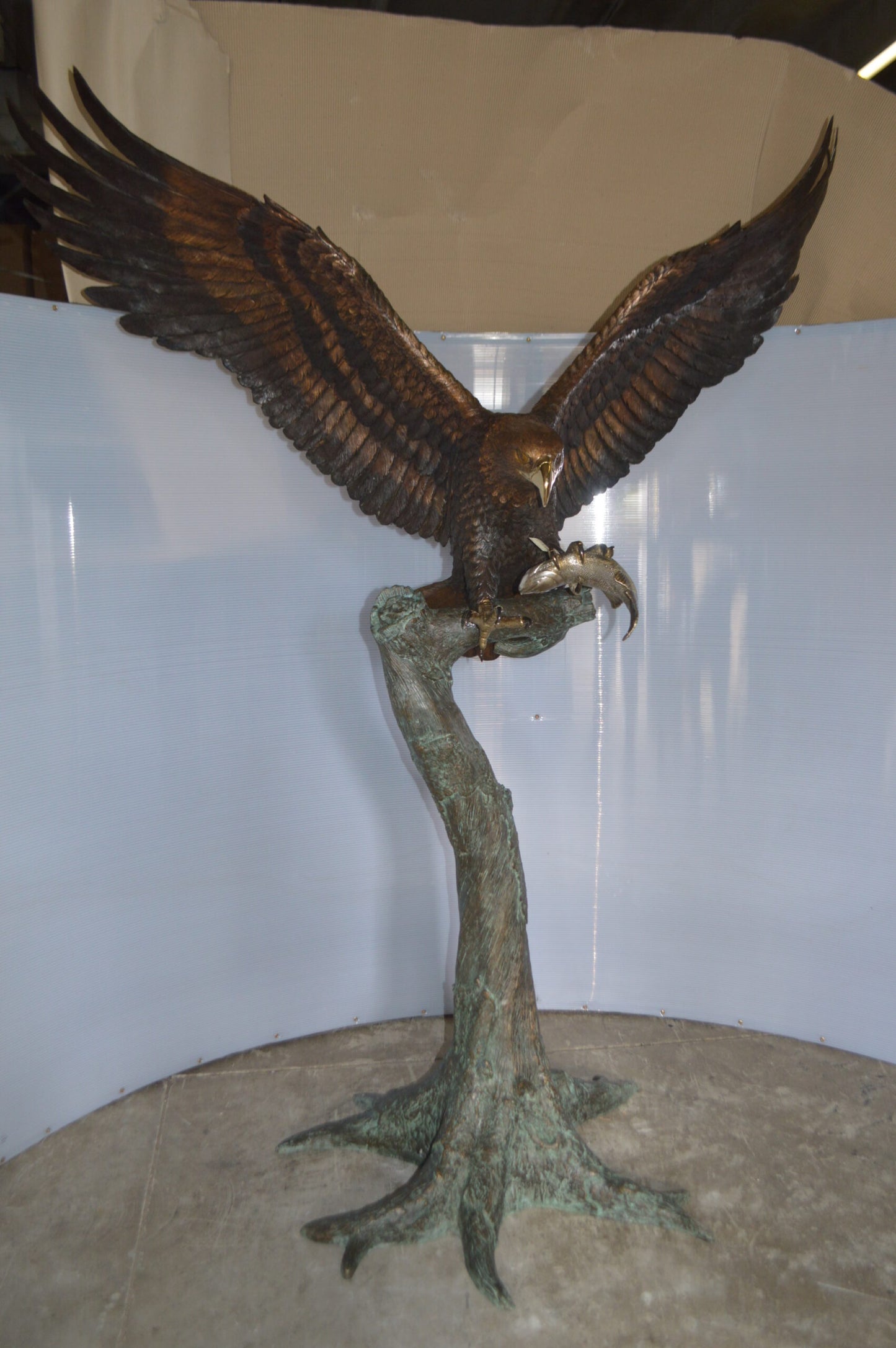 Landing Eagle on a Tree Giant Bronze Statue - Size: 72"L x 36"W x 88"H.