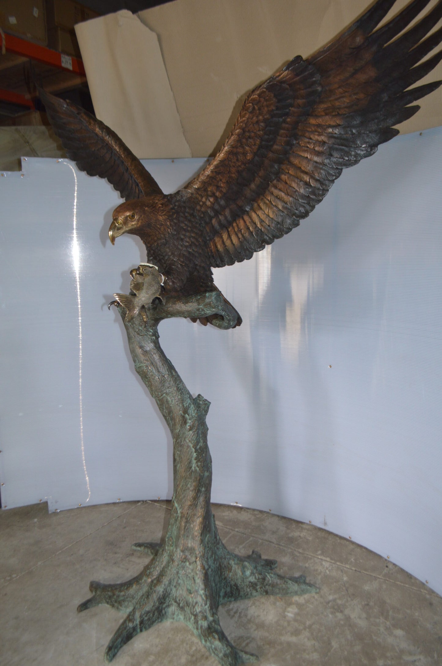 Landing Eagle on a Tree Giant Bronze Statue - Size: 72"L x 36"W x 88"H.