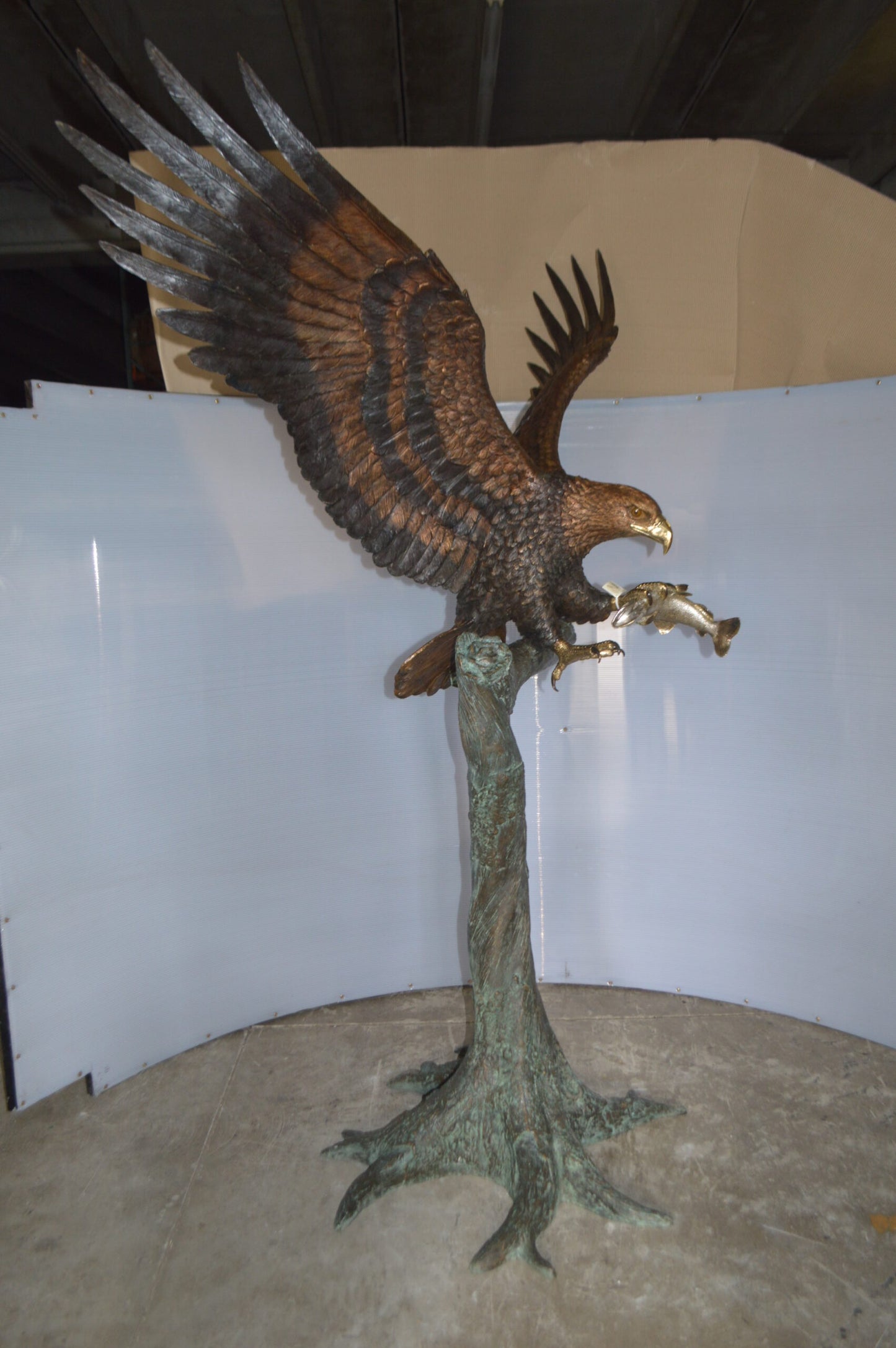 Landing Eagle on a Tree Giant Bronze Statue - Size: 72"L x 36"W x 88"H.