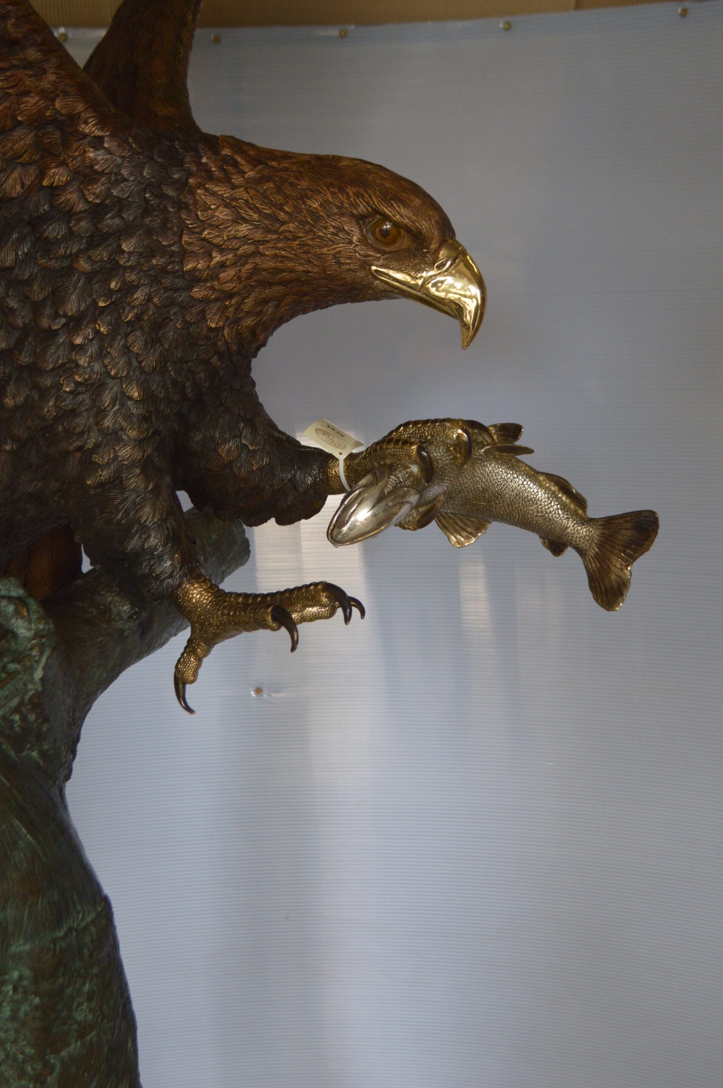 Landing Eagle on a Tree Giant Bronze Statue - Size: 72"L x 36"W x 88"H.