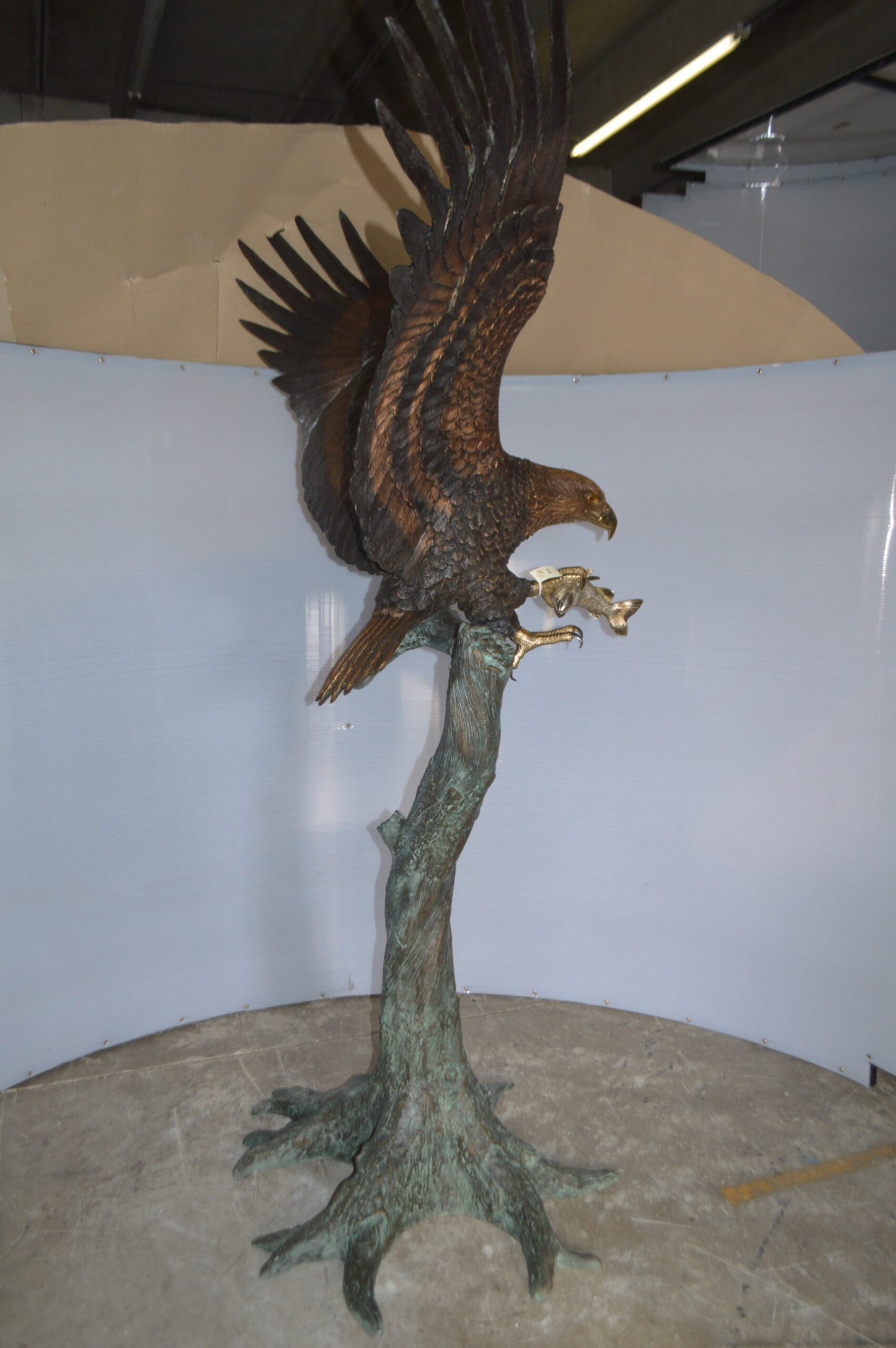 Landing Eagle on a Tree Giant Bronze Statue - Size: 72"L x 36"W x 88"H.