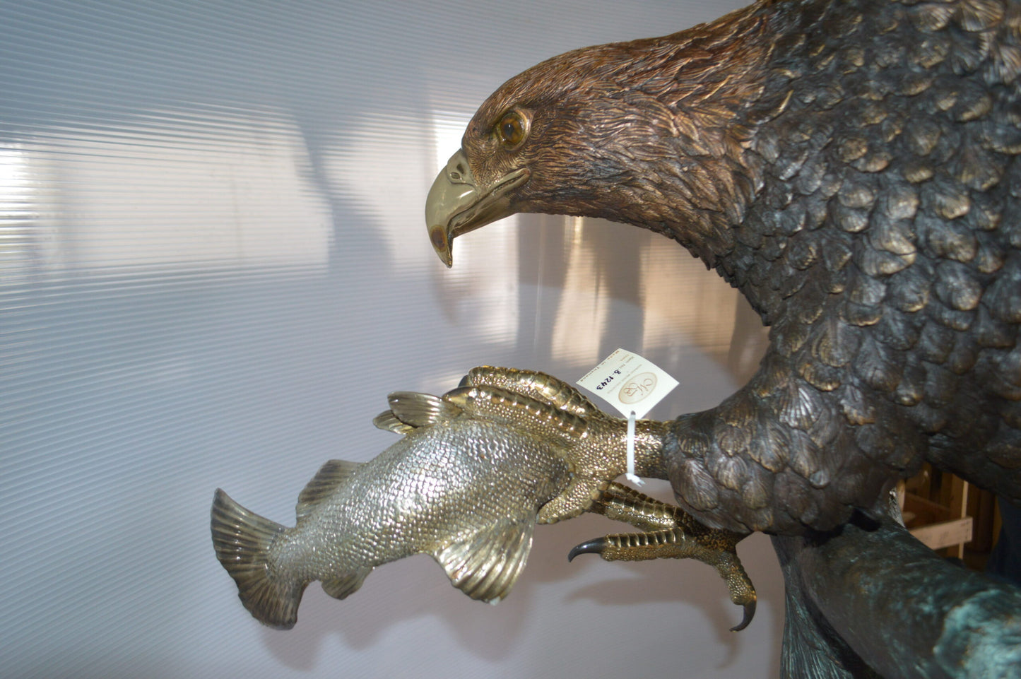 Landing Eagle on a Tree Giant Bronze Statue - Size: 72"L x 36"W x 88"H.