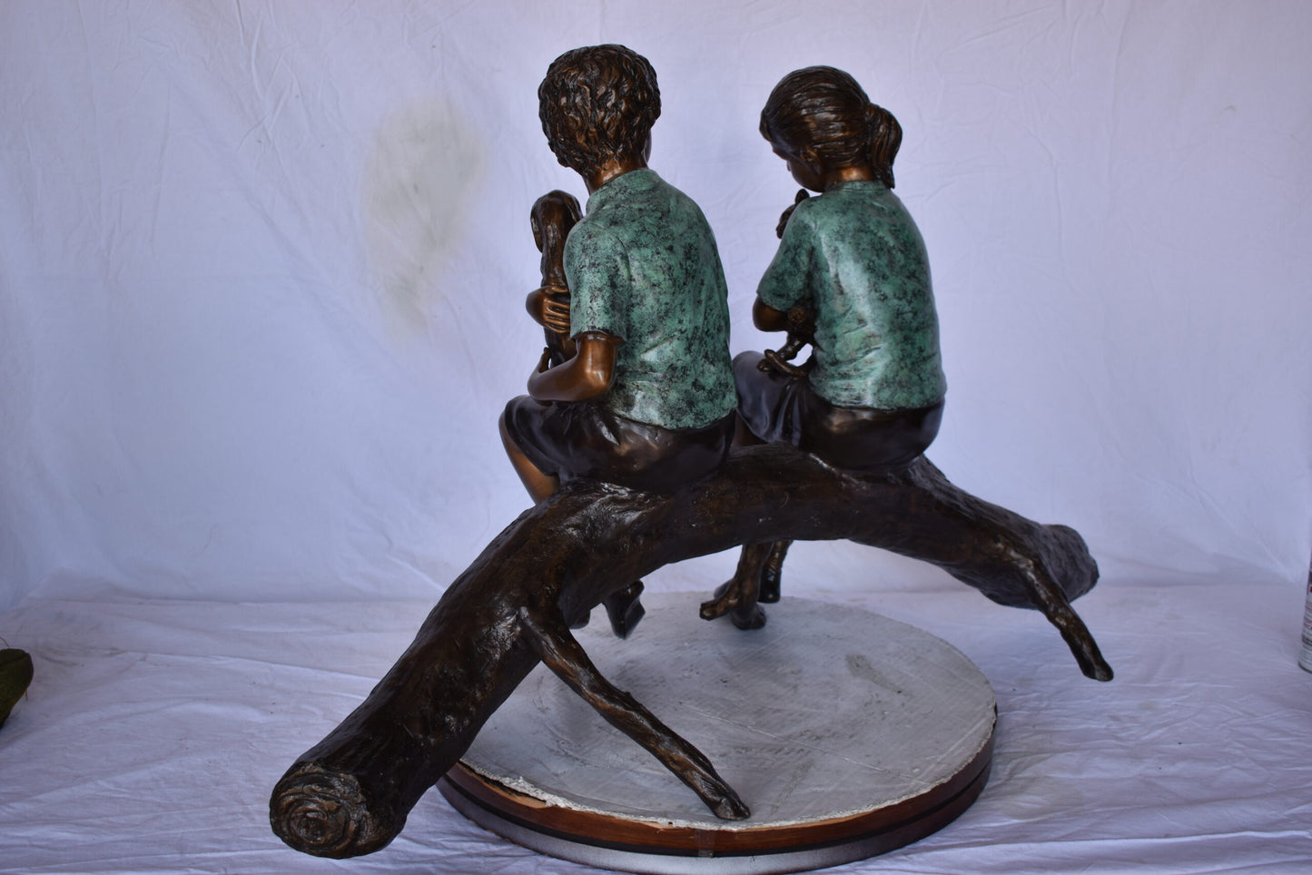 Boy and Girl with Pets Sitting on Log Bronze Statue - Size: 44"L x 22"W x 26"H.