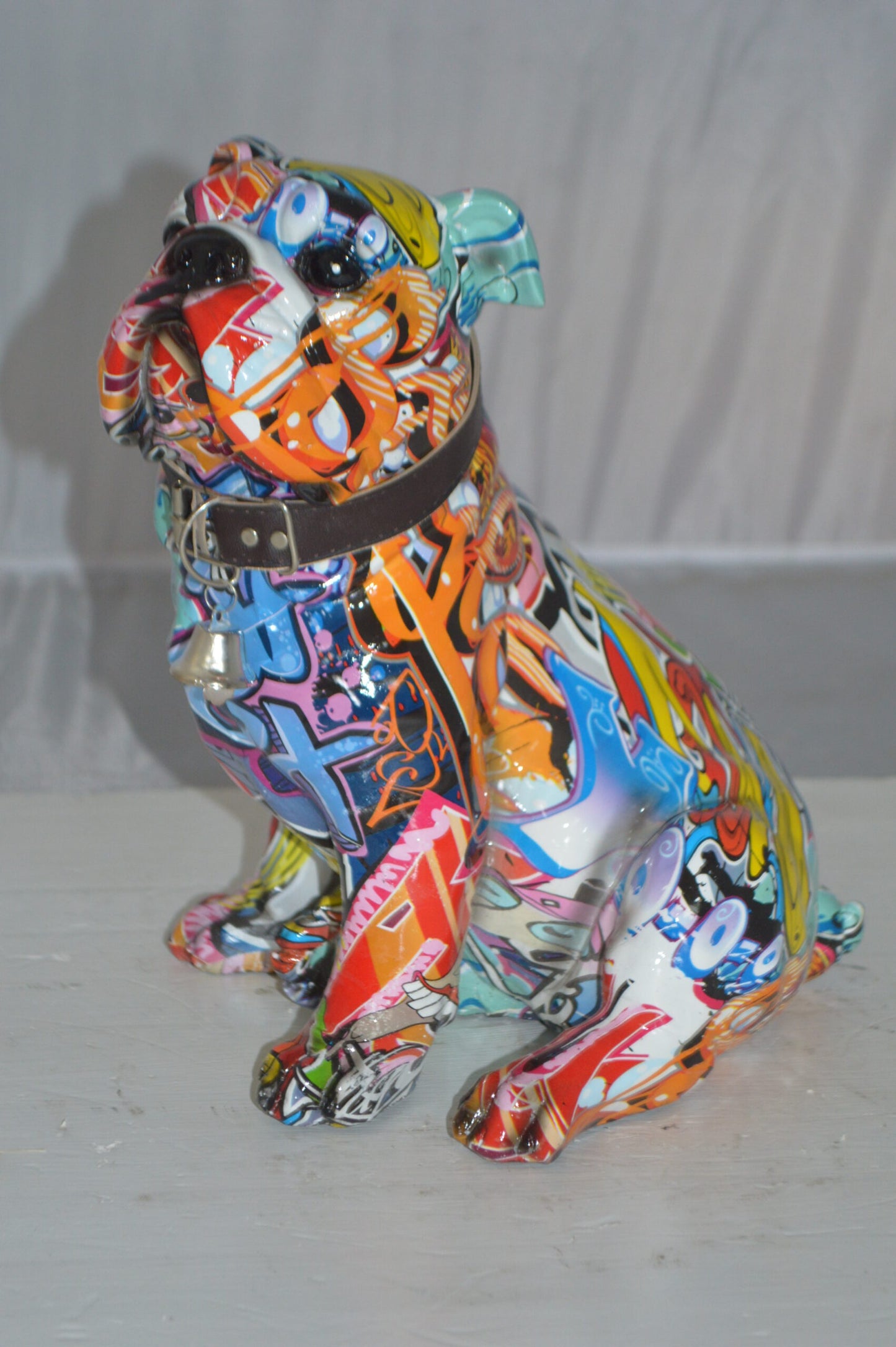 Modern Tie Dye Bulldog made of Resin - Size: 9"L x 8"W x 12"H.
