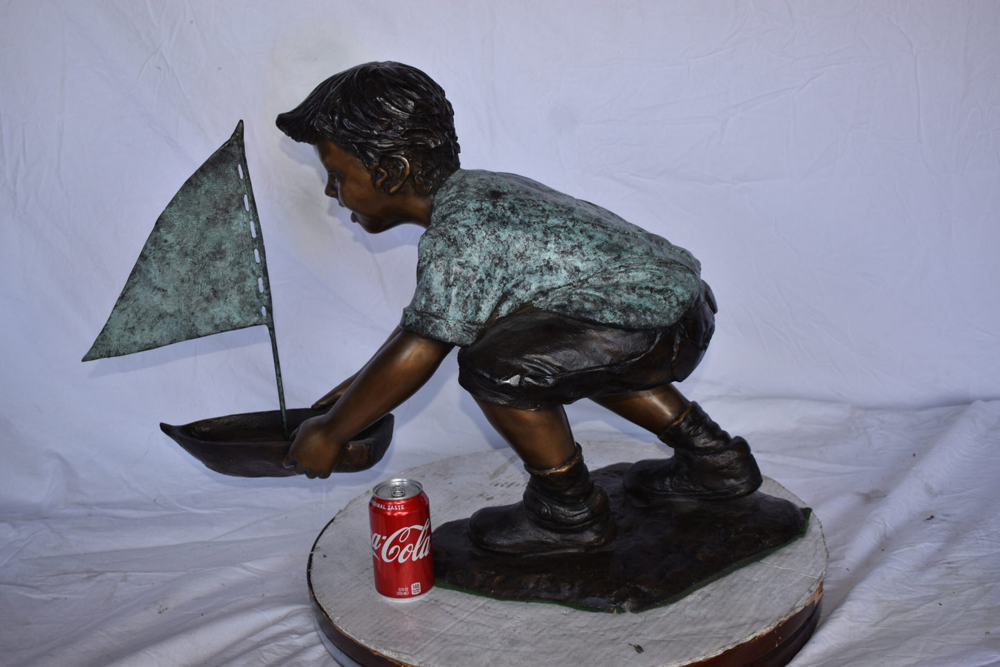 Boy Sends His Toy Boat on The Water Bronze Statue - Size: 16"L x 33"W x 24"H.
