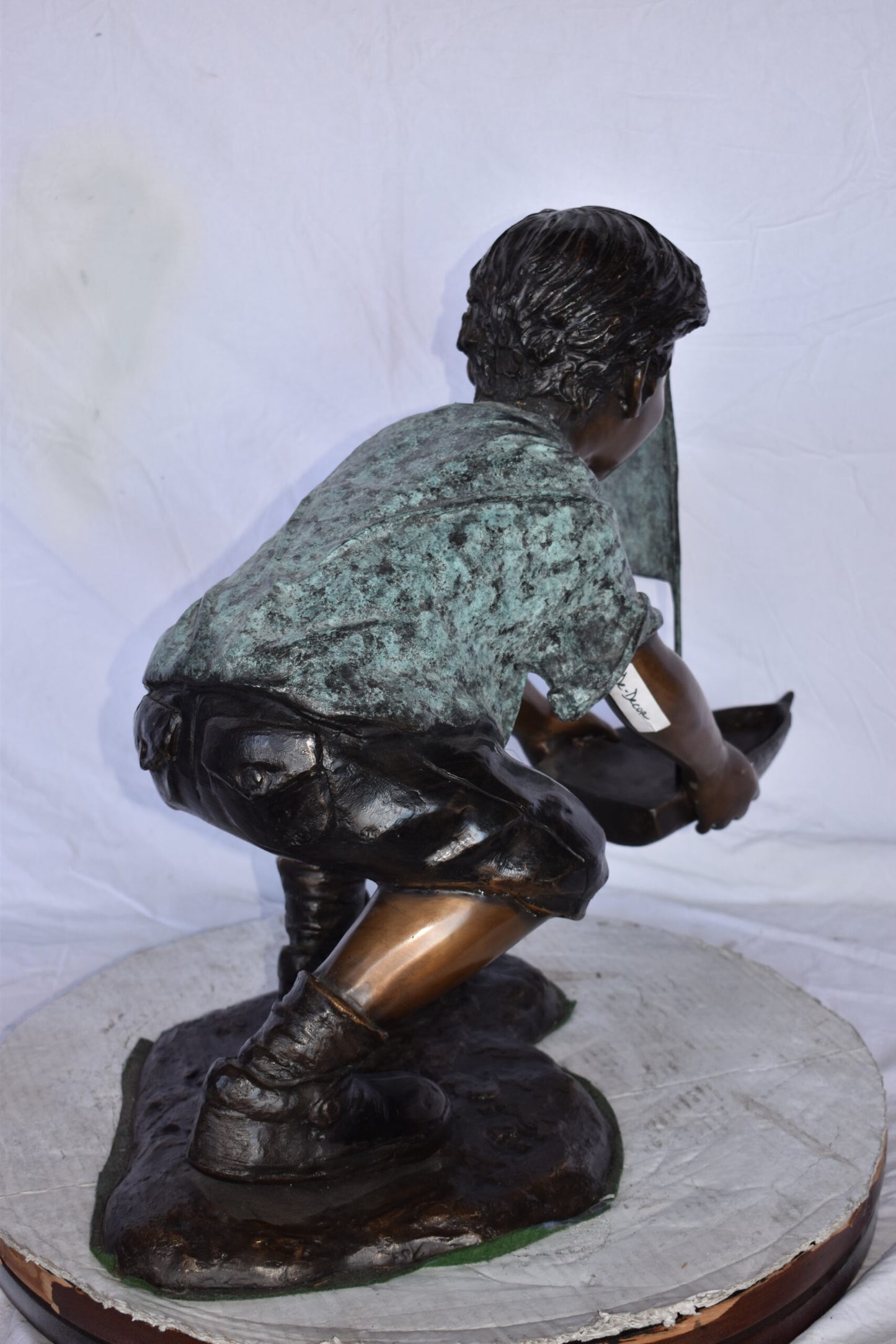 Boy Sends His Toy Boat on The Water Bronze Statue - Size: 16"L x 33"W x 24"H.