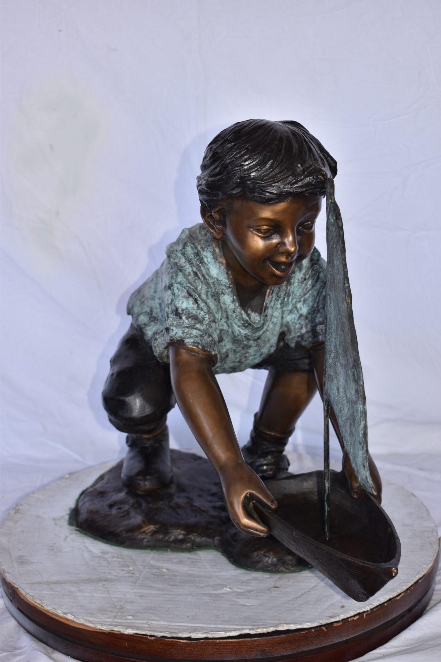 Boy Sends His Toy Boat on The Water Bronze Statue - Size: 16"L x 33"W x 24"H.