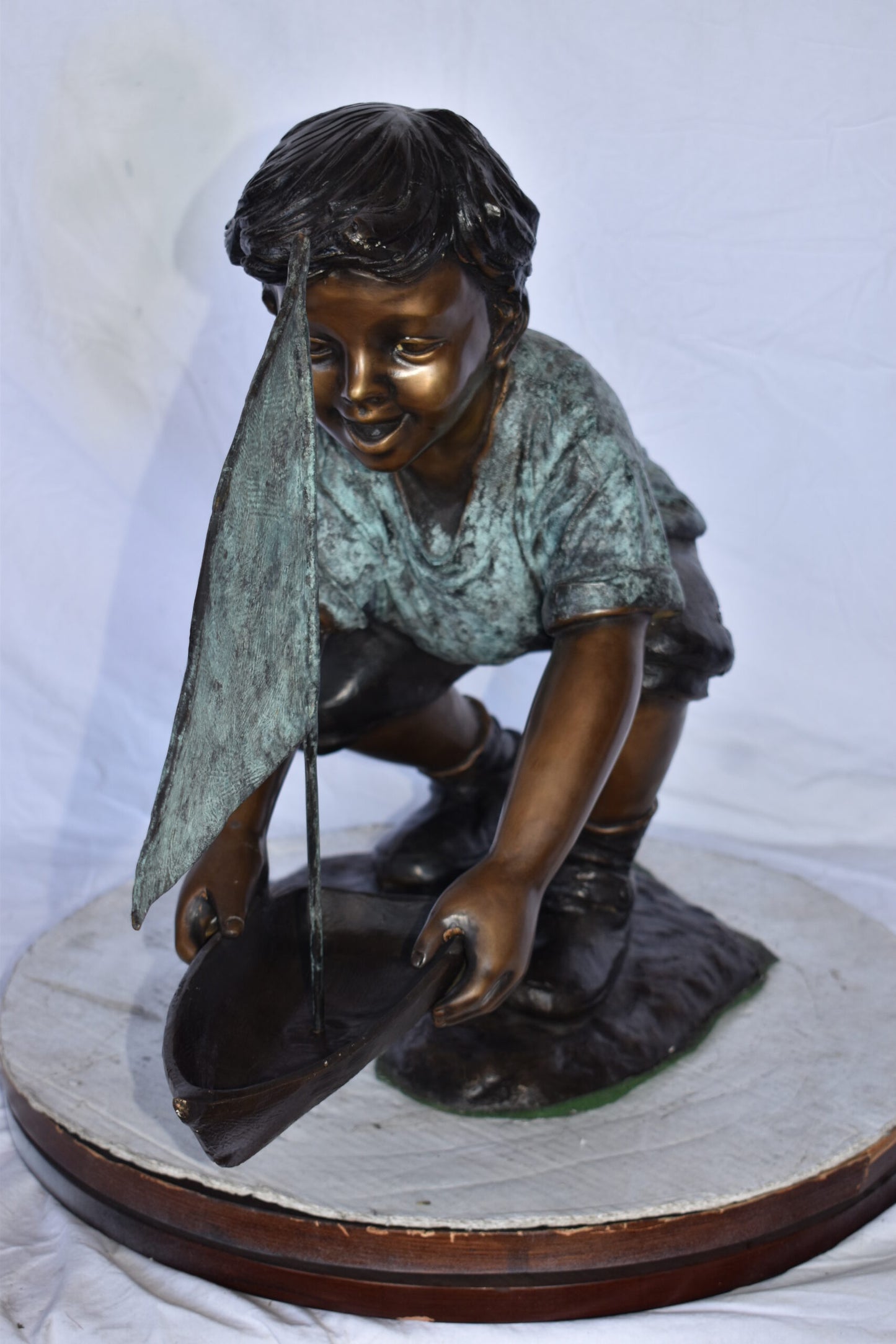 Boy Sends His Toy Boat on The Water Bronze Statue - Size: 16"L x 33"W x 24"H.