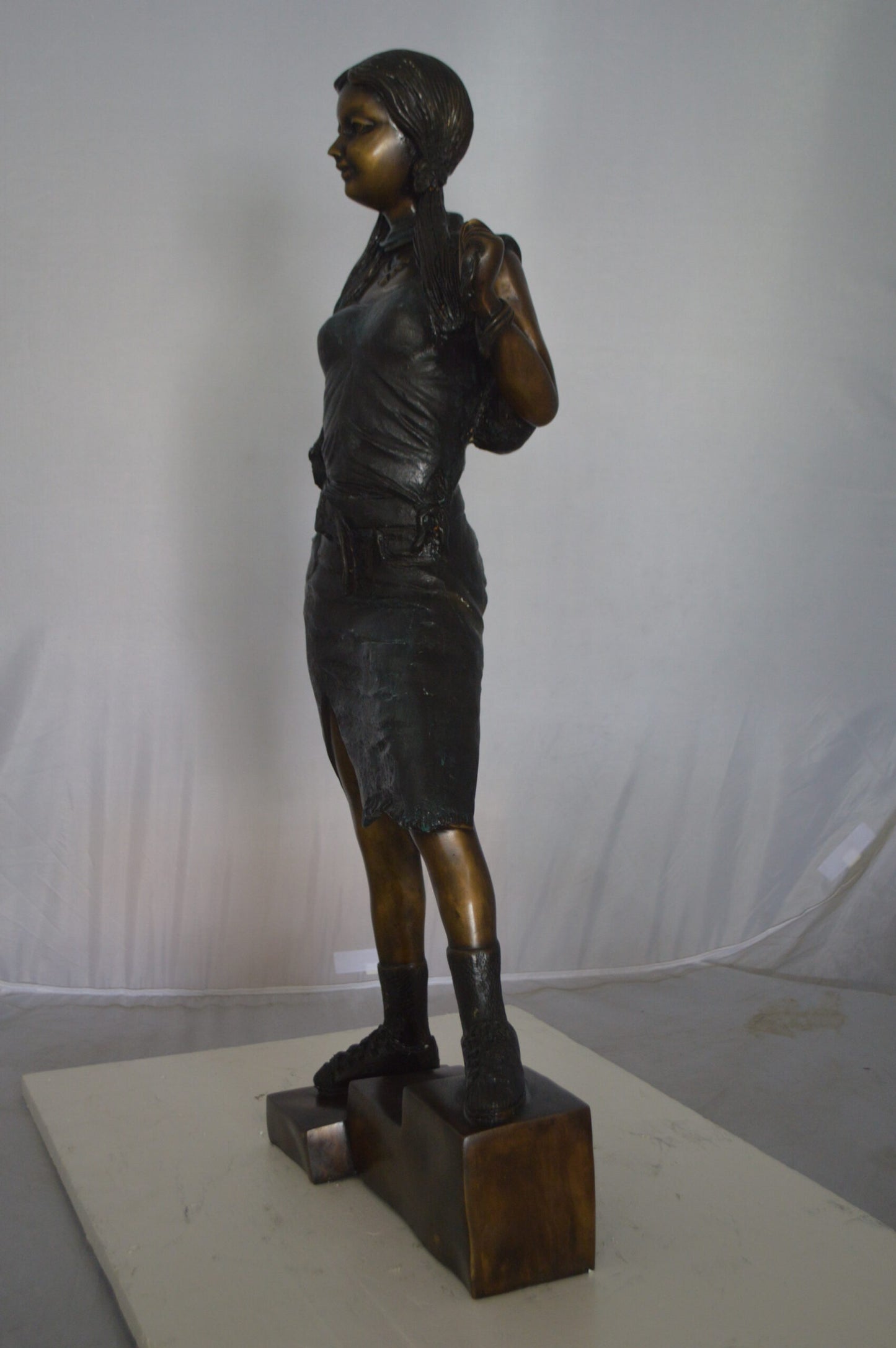 Girl Posing on Steps Bronze Statue - Size: 7"L x 12"W x 33"H.