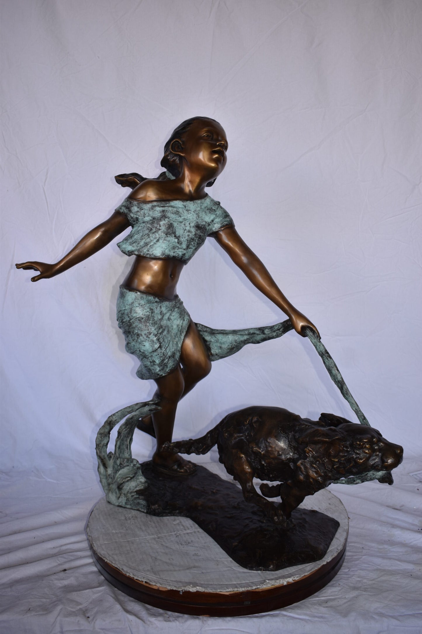 Young Girl Running with Her Dog Bronze Statue - Size: 16"L x 36"W x 39"H.