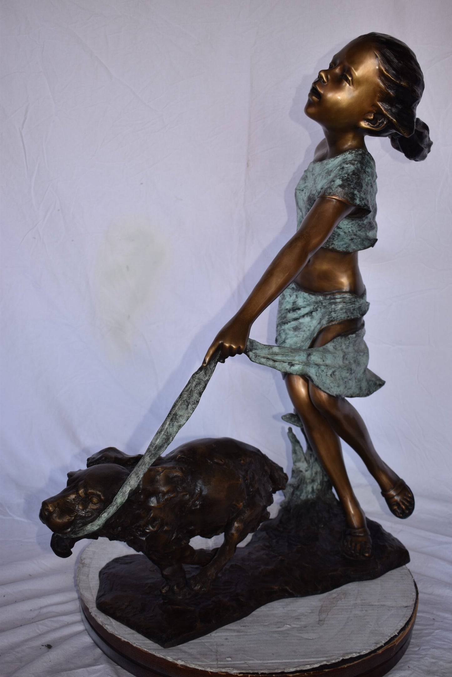 Young Girl Running with Her Dog Bronze Statue - Size: 16"L x 36"W x 39"H.