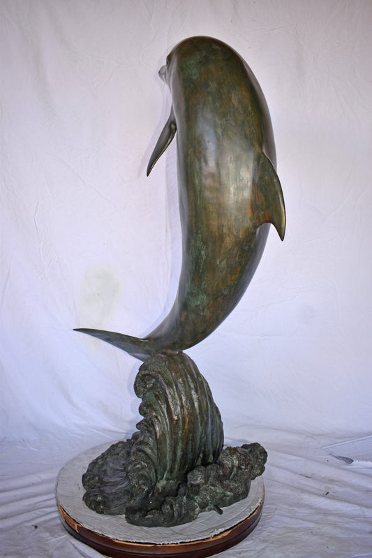 Fountain of A Dolphin Jumping of The Water Made of Bronze Size: 21"x 30" x 50"H.