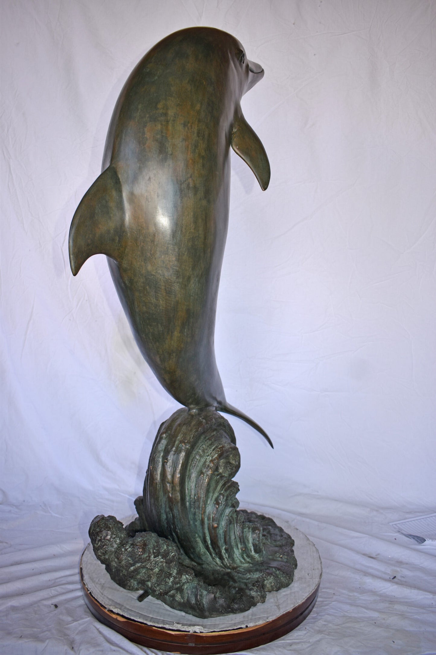 Fountain of A Dolphin Jumping of The Water Made of Bronze Size: 21"x 30" x 50"H.