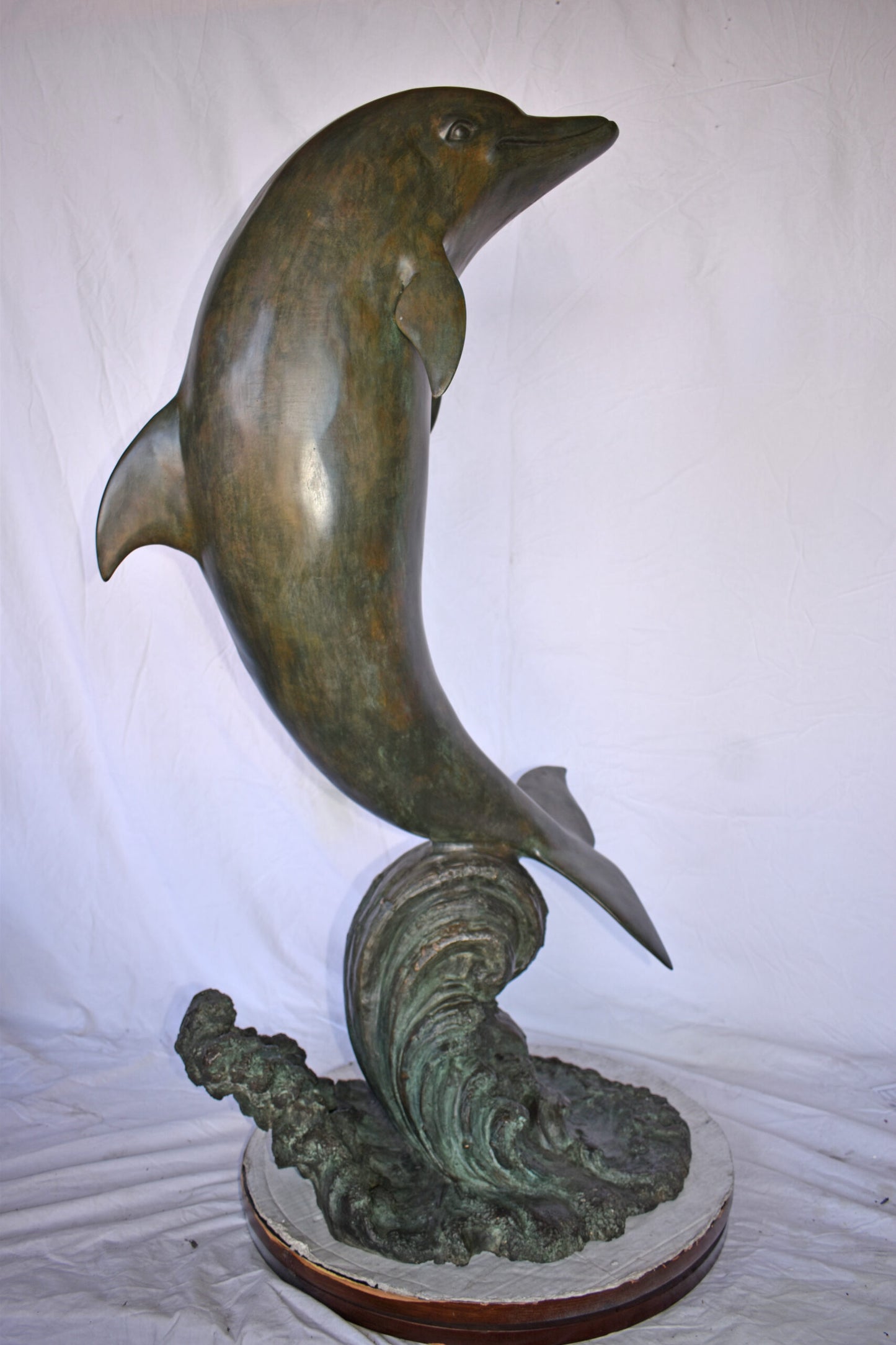 Fountain of A Dolphin Jumping of The Water Made of Bronze Size: 21"x 30" x 50"H.